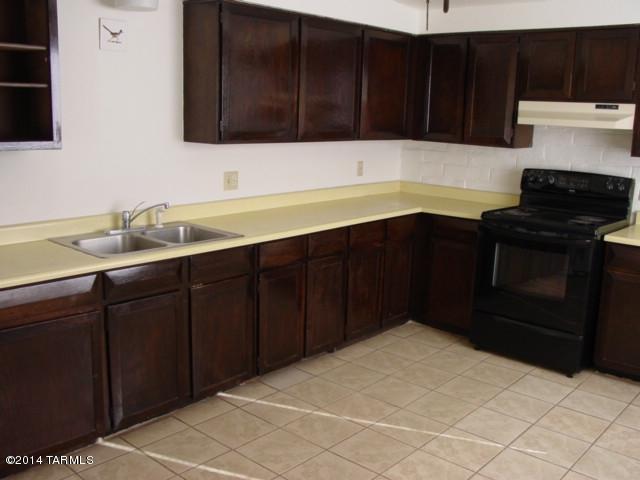 Super central location! Nice 2 bedroom, 2 bath duplex.  Tiled living areas with carpet in the bedrooms,  Move-in ready! Large back yard with uncovered patio. Covered front porch. Washer/dryer hook ups, Central ac. Spacious kitchen with plenty of cabinet space. water and trash collection included!