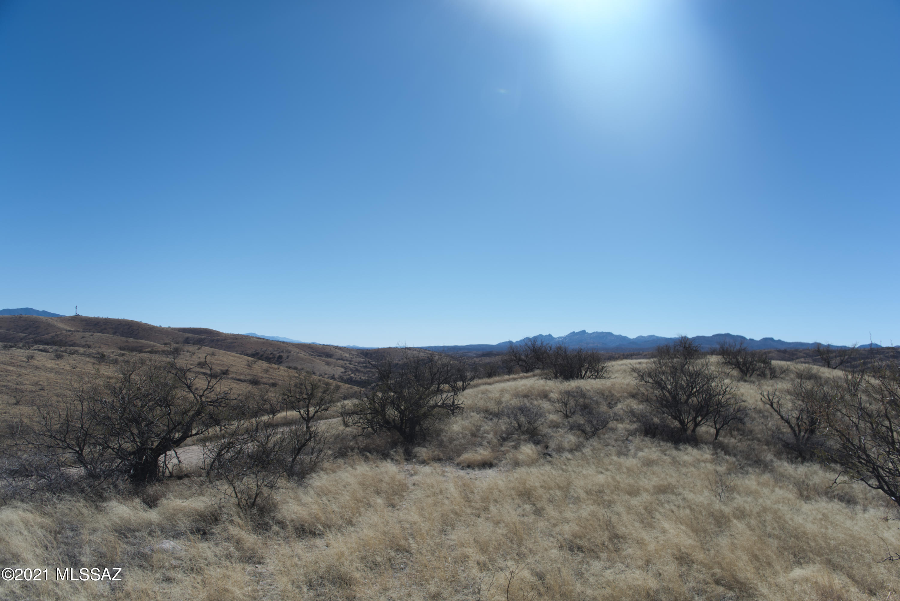 Beautiful hilltop 1.31 acre lot, ready to build on. Surrounded by mountains and great panoramic views! Lot extends all the way to Burdon Rd. Owner is easy to work with and open to all offers. Owner financing available, making it easier to build your custom dream home! Adjacent 1.85 Acre Lot also available. Buy both lots to get a great deal! Owner is related to a licensed AZ Real Estate Agent.