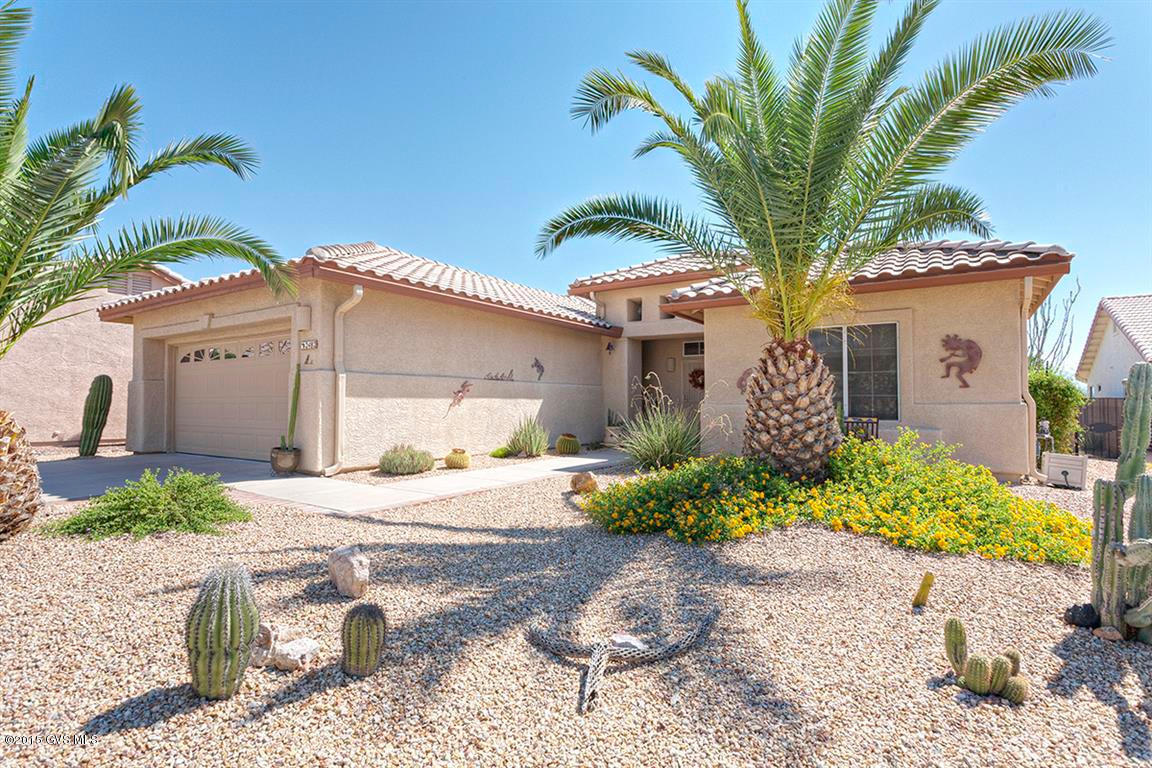 Stunning Santa Rita views from your poolside and patio. Relax and enjoy this resort like backyard complete with built-in barbecue and mini-fridge. Practically maintenance free Pool with Turbo Sweep feature. This NO GVR home has been lovingly cared for and has upgraded features including a kitchen total remodel with cherry cabinets, granite countertops and stainless appliances. Matching tile floors throughout. Granite countertops and dual sink in master bath. Tile shower. Custom built entertainment center with Gas Log Fireplace in living room. Extended garage with cabinets. Many more fabulous features in this three bedroom split floor plan. Stereo System & W/D do not convey.