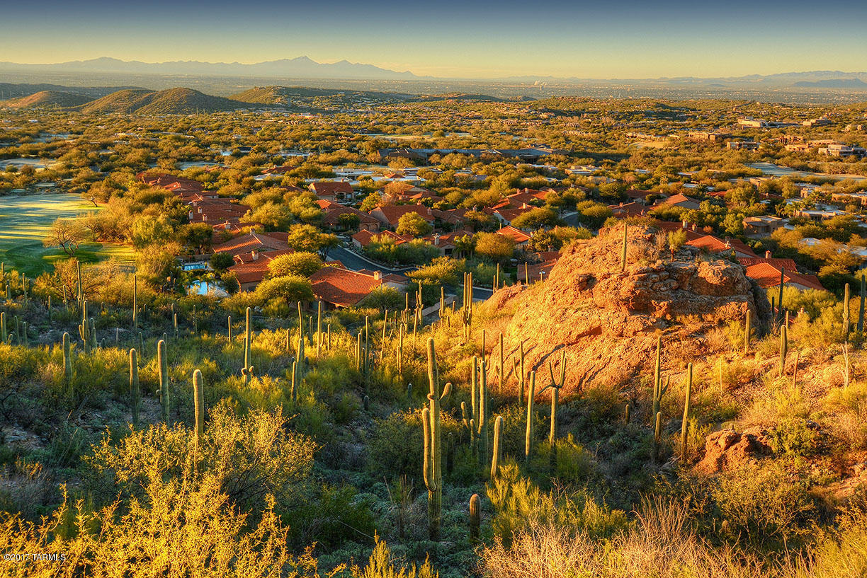 A breathtaking rock formation anchors this stellar homesite in guard gated Ventana Canyon. This awesome homesite is perched high above the rest. This special lot offers an exceptional opportunity to build on one of the few remaining lots in this prestigious country club community. (Note the actual site is up just east of the rock formation. Offers stunning golf course, city and mountain views! Extensive home building plans have been completed for this lot by renowned architect Kevin Howard