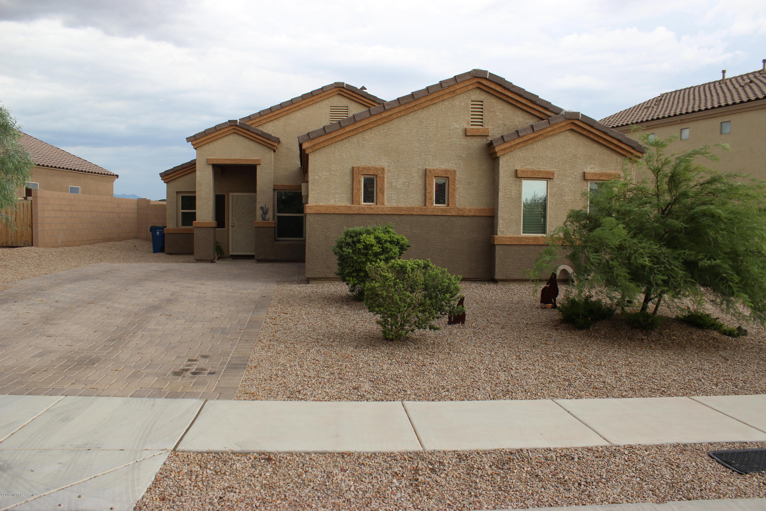 Located in the Award Winning Vail School District, This Beautiful and Extremely Well Maintained Home is Perfect! Windows are XO Energy Core Energy Efficient R5!!! Single story with Tile Everywhere, Wood blinds stay! Large laundry room, ceiling fans throughout entire home! Closets have adjustable clothing rods! Oversized garage with windows and blinds! Extended patio slab with professionally laid brick and 220 electrical originally intended for Jacuzzi! Brick-wrought iron back fence with a natural wash in back! This Home is Perfect!!! Owner will be moving shortly to allow you unobstructed viewing!