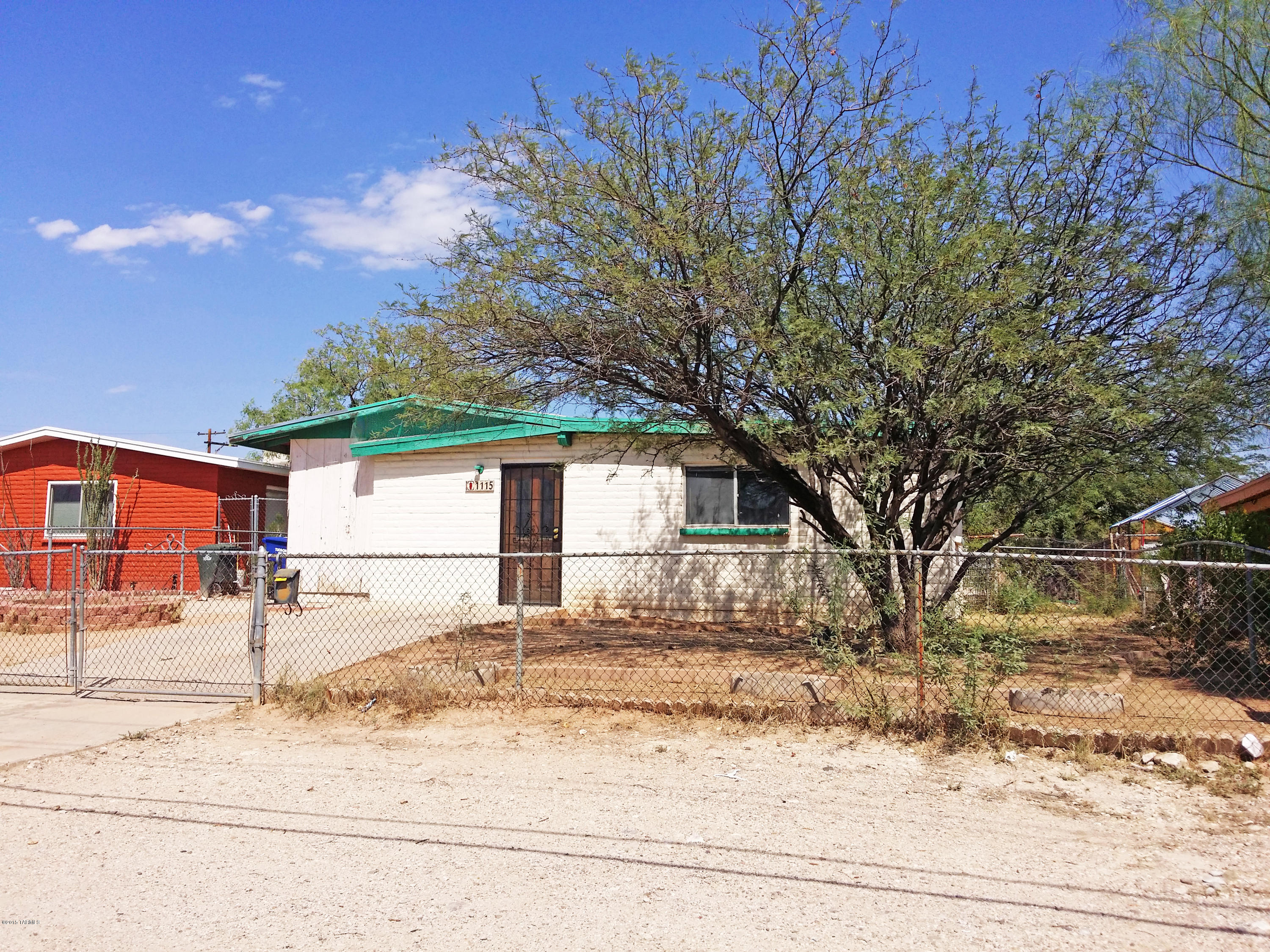 Home sold ''as-is''. Was occupied by tenant for over 10 years.  Needs TLC.  Large lot - unique property with a full size commercial-looking bar in front room. Large shed out back for extra storage.  Great central location.