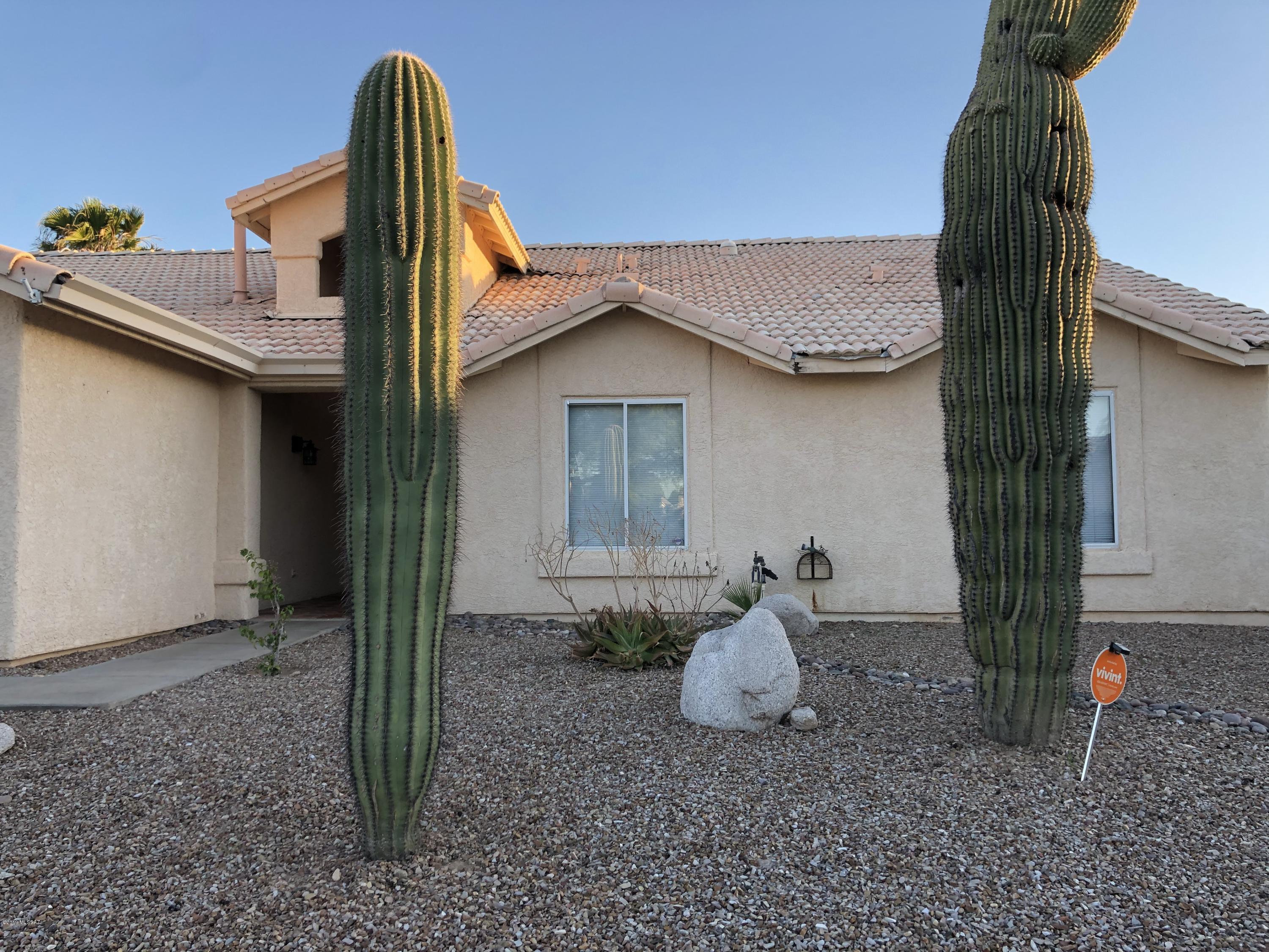 Large single story home with 4 bedrooms 2 baths plus a solar heated pool, awaits it's new owner! Features and upgrades include:  Rheem 5 ton 15.5 seer  installed in September/2018, custom granite counter tops, tile floors, custom double doors to backyard from family room and master bedroom, custom BBQ and outside wood burning fireplace, gated solar heated pool backs to common ground adds much needed privacy.  Just in time to enjoy a splash in the pool on these hot summer days!  Tesla solar system makes for crazy low cooling costs.  Solar Contract attached for review. No HOA