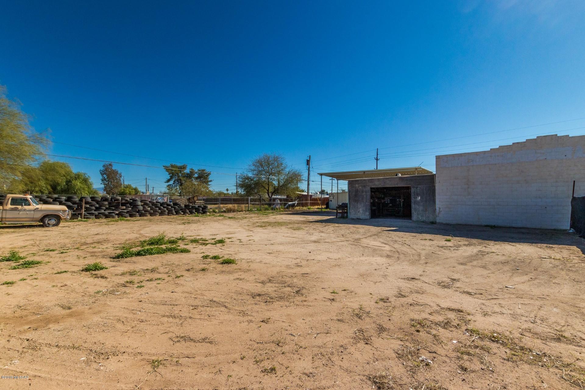 Property is listed with the buyer in mind. Massive opportunity for an owner or investor to own two lots just South of Davis Monthan AFB. Property has high visibility and exposure for any storefront. This commercial property is currently set up as a profitable mechanic shop, but owner left property vacant to allow the buyer to immediately create any asset they want. Currently zoned for C-2 which entails retail, office, and other civic uses.