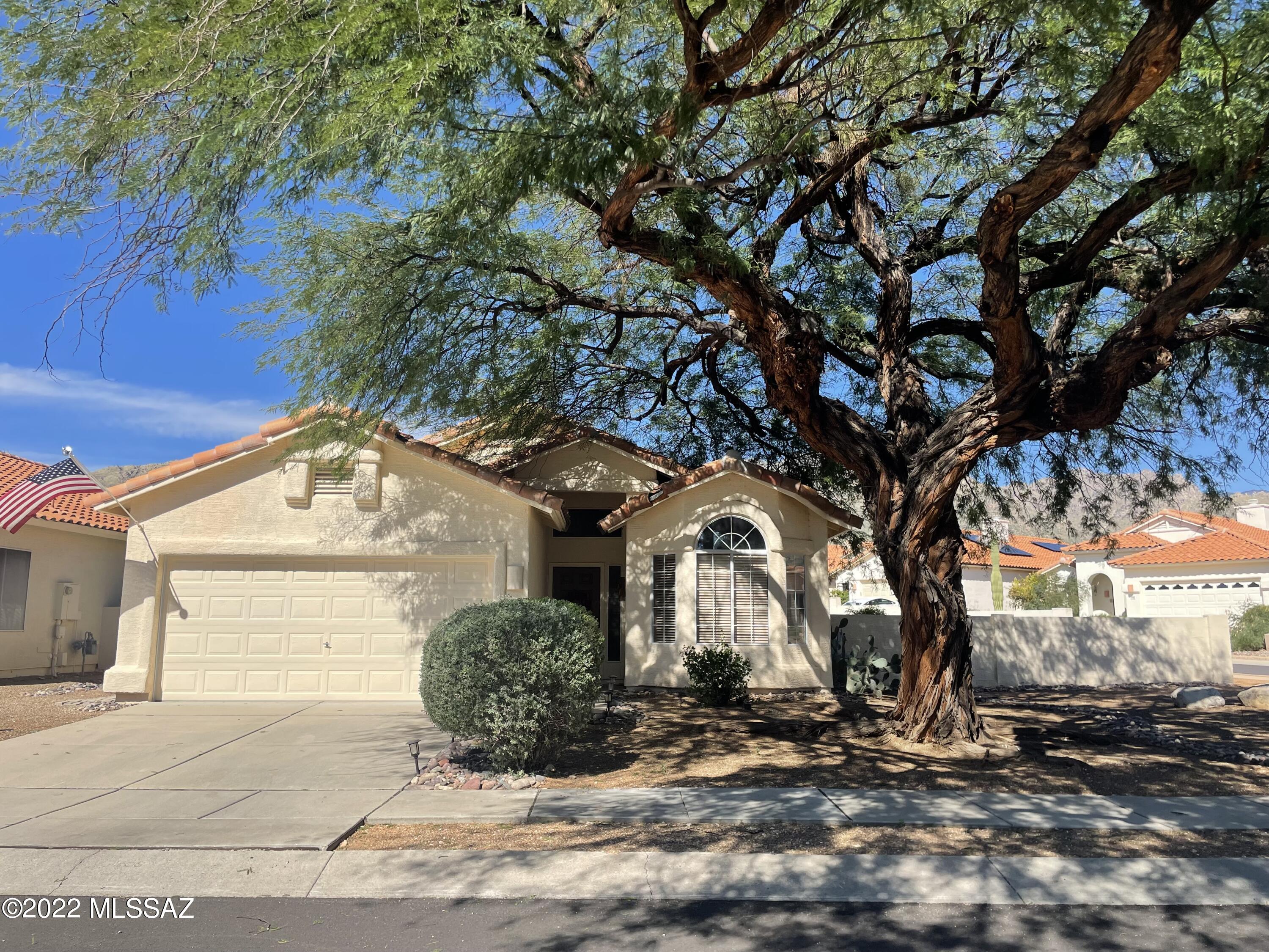 Beautiful Catalina Foothills home just down the street from Sabino Canyon Recreation area.  Enjoy gorgeous mountain views and a large corner lot.  This move in ready home has newer flooring throughout and a completely remodeled master bathroom.  The kitchen features stainless steel appliances and a gas stove.  The living room is nice and open with vaulted ceilings.  Split floorplan. Enjoy the beautifully renovated bathroom with walk in shower and garden tub with feet! The back yard allows for privacy and enjoying the mountain views of the Catalina Mountains!
