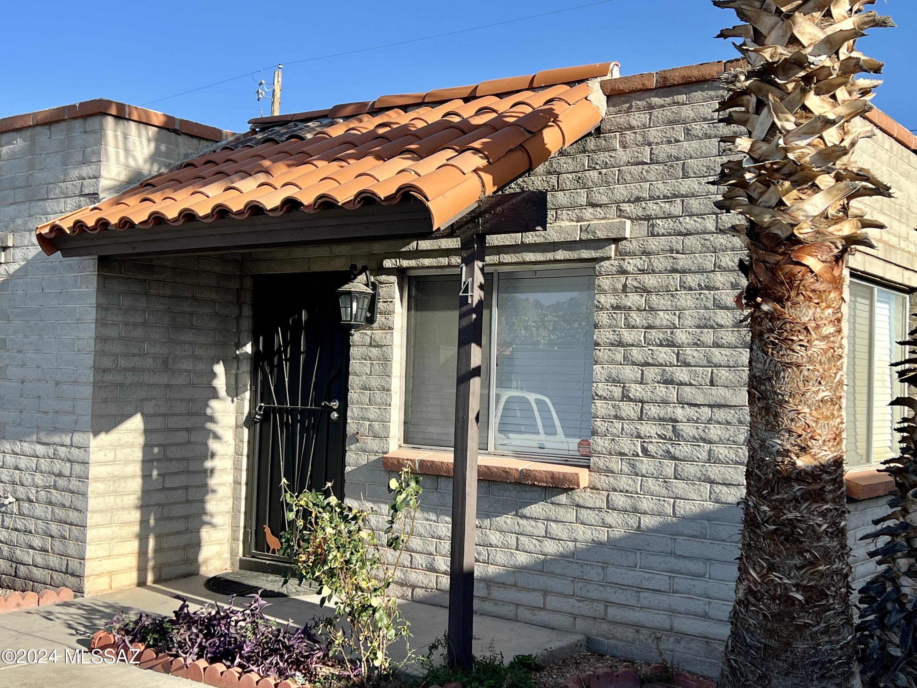 Discover comfort and convenience in this charming 2-bed, 1-bath condo. With 768 sq ft of space, enjoy a cozy living area, well-appointed kitchen, and peaceful bedrooms. This corner unit features include a private patio, one assigned covered parking space. New roof 2023, new exterior fence 2023 HOA includes common area maintenance and pool! Ideal for first-time buyers or investors seeking a low-maintenance lifestyle in Tucson's vibrant community. Priced to sell quickly, schedule your showing today! Co-Listing Agent is related to Seller. *TV does not convey*