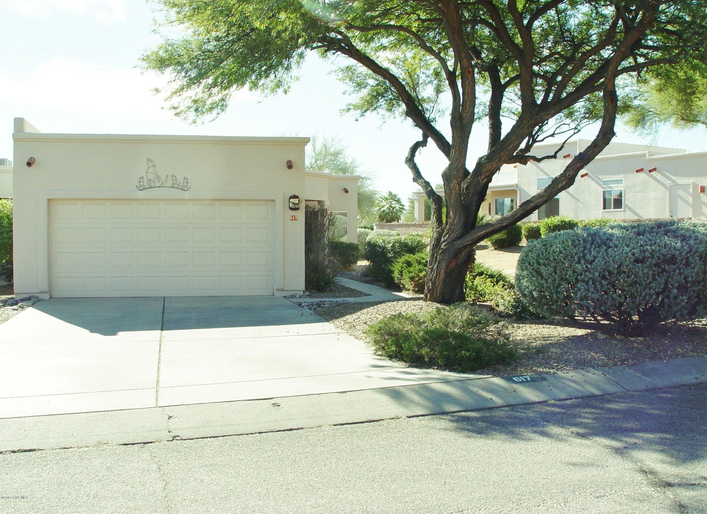 This end-unit townhome in SpringPointe has high ceilings and several clerestory windows which give a light and airy feeling as you step into the home. Continuing through the home onto the back patio, you get a view of the Santa Rita Mountains plus the privacy and buffer of the surrounding common space and wash. A nice size master with a walk-in closet also boasts exterior automatic rolling blinds for the warmer days in Green Valley. A lovely wood fireplace accents the spacious living area. An efficient galley kitchen boasts a large pantry closet and newer appliances. A nice feature of the kitchen is the eating area in the bay window where sunshine creates a happy space any time of the day. This Dorn-built home is priced to sell so that you can put your own personal touch on it.