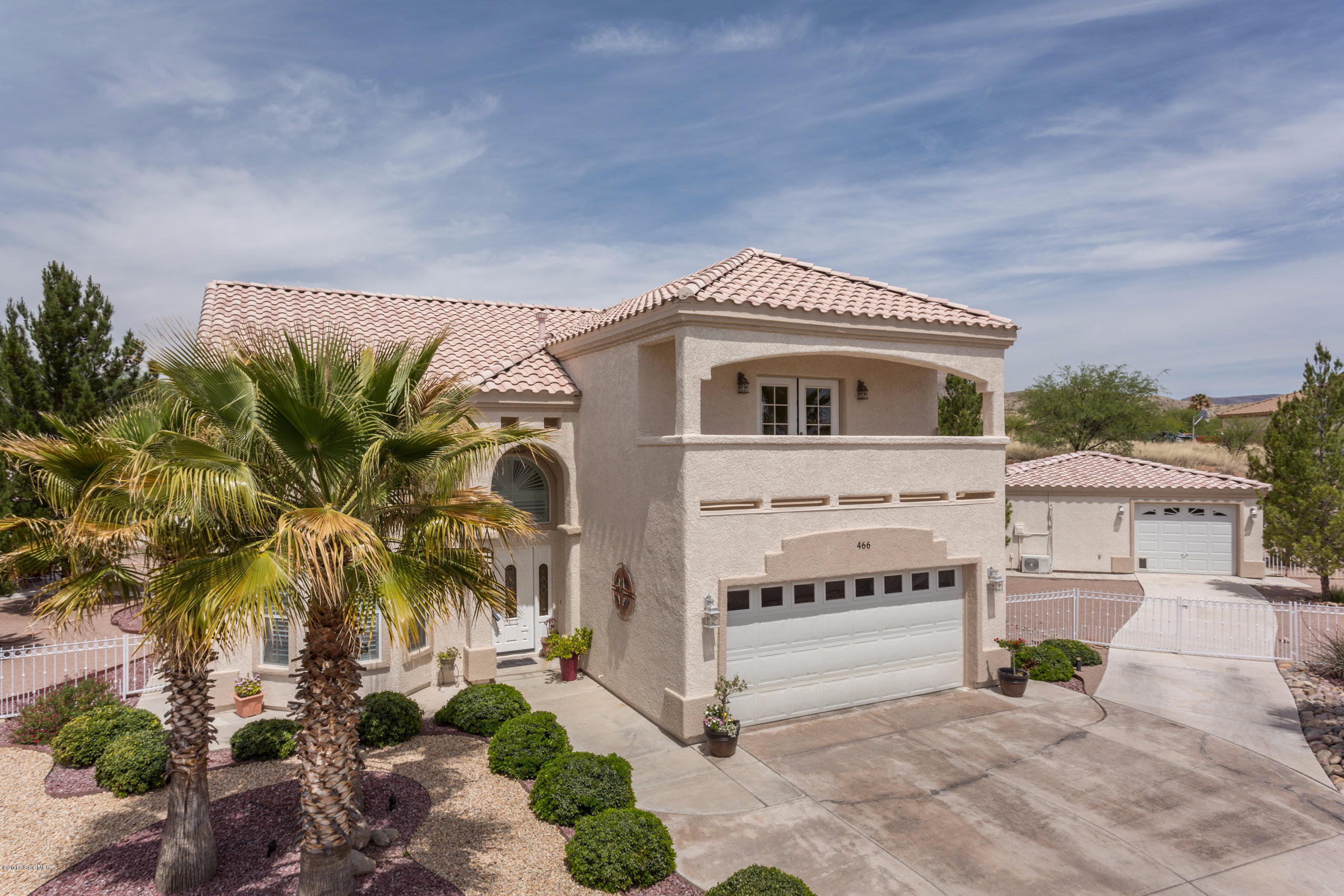 Exceptionally built two-story home with 4 bedroom/2.5 bathrooms and a separate 1 bedroom/1 bathroom guest house located on premier lot in coveted Rio Rico Subdivision! Home features tile roofing, two car garage, premier lighting, plantation shutters, wood flooring, fireplace, built-in aquarium, bar area, entertainment system, travertine counter-tops, laundry room, two balconies with mountain views, and is completely pre-wired for surround sound! Exquisite kitchen....(please see 'more' feature) ...includes top of the line granite counter tops, breakfast bar/island, gas stove, and premier stainless steel appliances! Master bathroom includes walk-in shower, spa/tub, travertine tile, and dual sink areas. The home was constructed using 2 x 6 construction for additional insulation and  an overall stronger build. Front and back yards are an entertainers paradise with custom landscaping/irrigation, block wall, full-length covered patio, gazebo with built-in barbecue/sink/refrigerator, a concrete slab for above-ground pool or basketball court, and established vegetation! Guest house includes bar area, garage door entrance access, pool table, and surround sound!|\n|