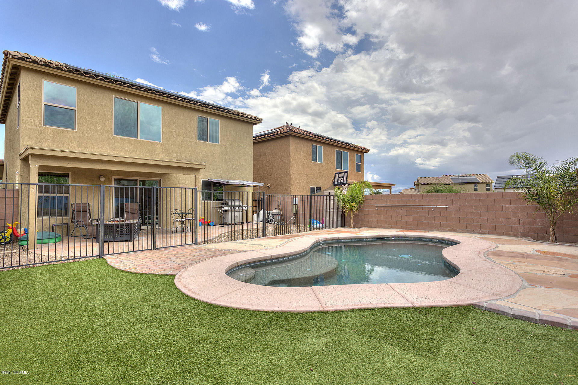 Are you ready to walk out your back door and jump into your very own salt water pool? Owning this home means you can do just that. This 2-story Platino model by Meritage is only 5 yrs old with open floor plan/great room and Master bedroom downstairs. Upstairs you'll find a large loft/bonus room for additional living space and 3 more bedrooms. From bonus room you even have a peek-a-boo mountain view! Tile & laminate in downstairs living area, custom closets, extra shelving in master bath, ceiling fans, pendant lights over breakfast bar, patio pavers, pool and solar panels are just some of the improvements Sellers have added to this already incredibly energy efficient home. There are more GREEN features than I can list! And did I mention the beautiful salt water pool powered by solar  panels leased from Solar City to keep your electric bill low all year long. The perfect home for a young family, in a family friendly neighborhood with it's own park, playground and walking trails. And shopping couldn't be much closer!