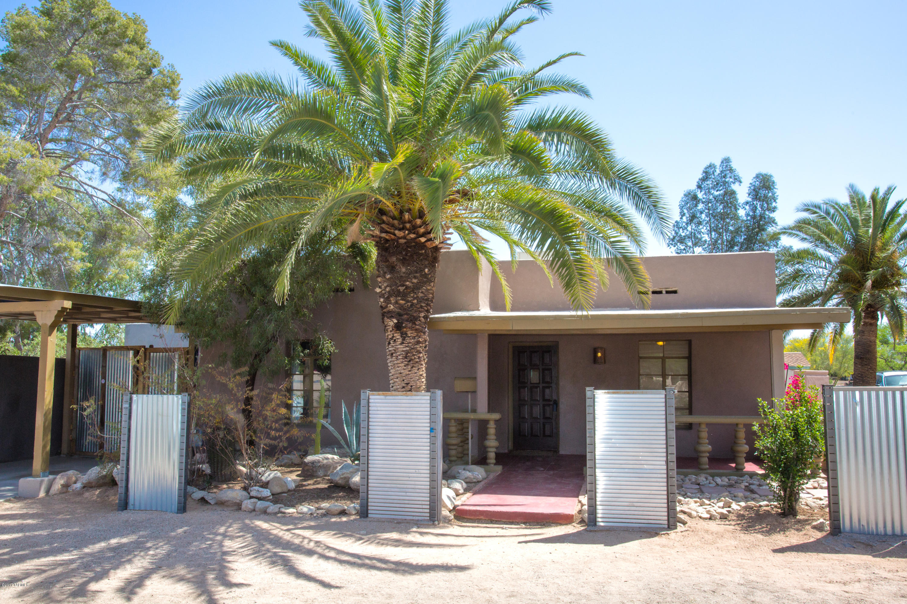 Charming home near U of A in Blenman!  You will not want to miss out on this spacious 3 bedroom/2 Bath corner lot home.  Bonus room that is not included in the assessors square footage opens to the large backyard with a gazebo, pool and spa perfect for entertaining.