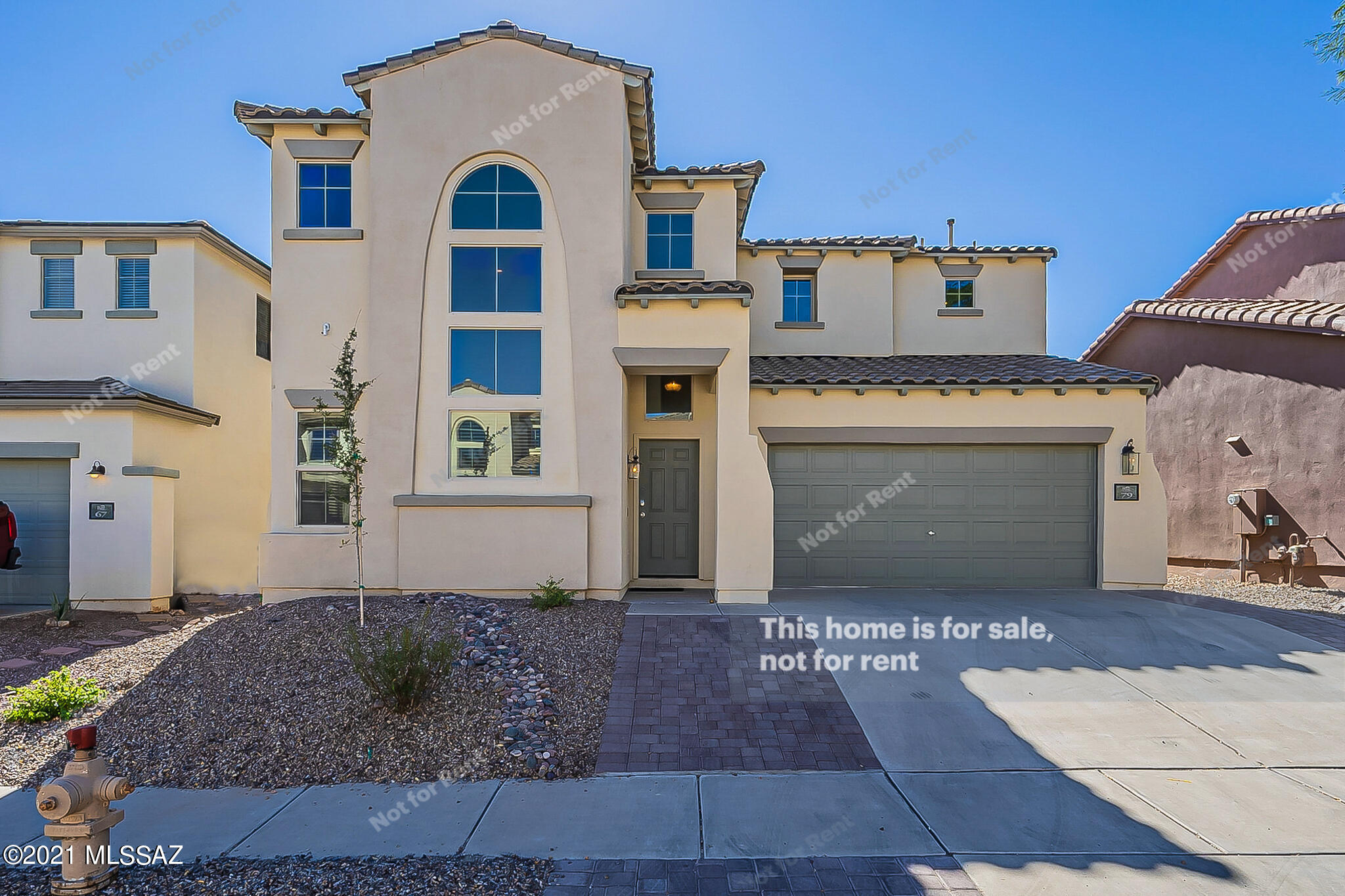 This Sahuarita two-story home offers quartz countertops, and a two-car garage.