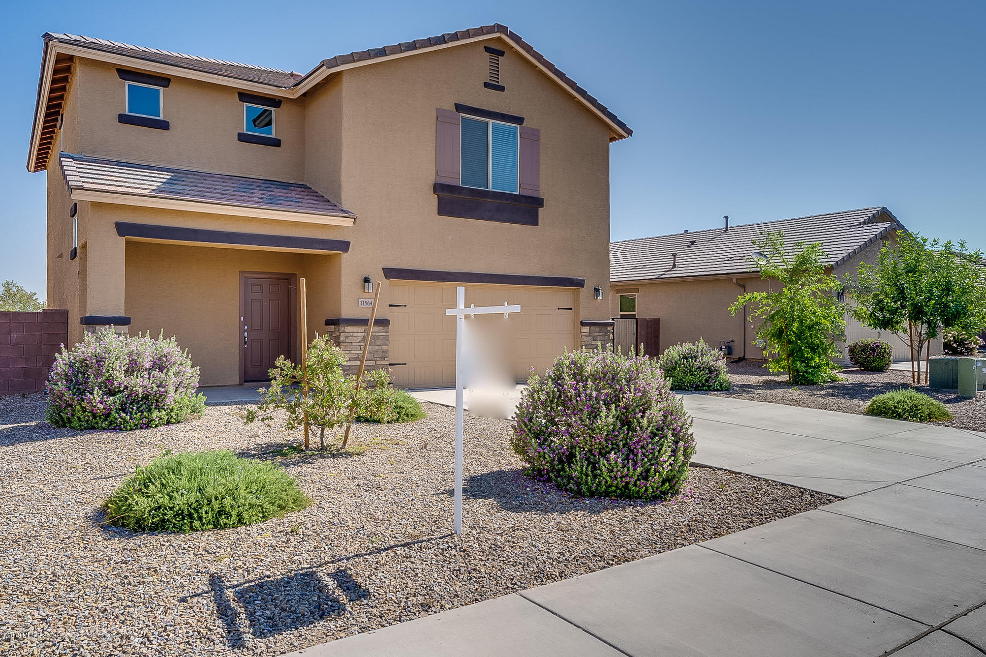 Practically new! This beautiful two story home was built in 2017 and boasts granite kitchen counters, tile
floor, new paint, and a grand entrance. This 4 bed, 2.5 bath home is located in the highly desired area of Marana with easy access to i10,
restaurants, shopping, and businesses. Laundry room is located upstairs with all four bedrooms! Enjoy warm summer nights in the large
backyard, ready for your special personal touch! Located right behind the home is a green area including a paved walking/running path that
connects throughout the neighborhood. No need to wait for a new construction home to be built, this one is ready and waiting for you!