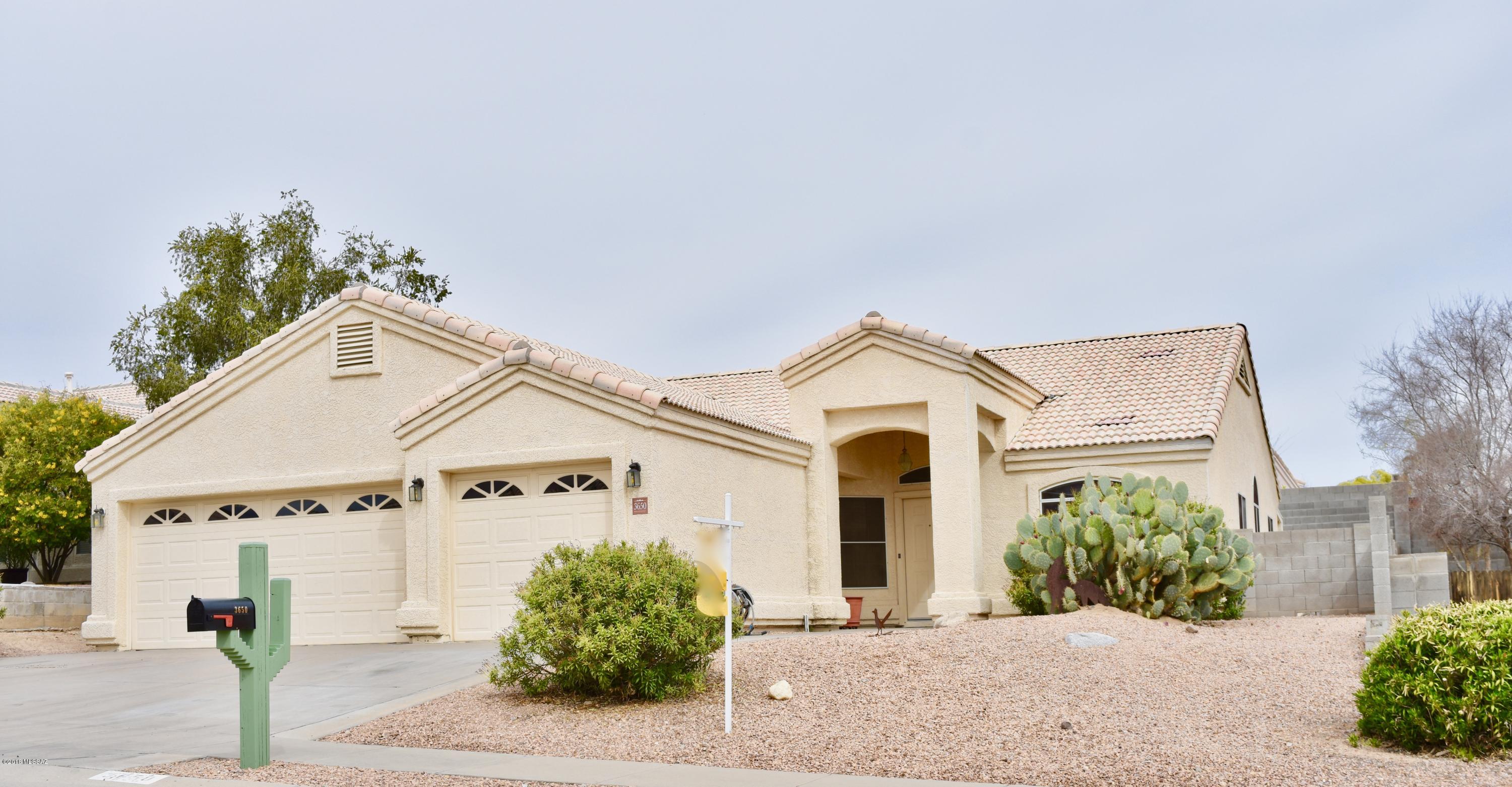Amazing 4 bedroom 2 bath with roomy 3 car garage with extra storage and sparkling pool. Kitchen is open to breakfast area dining or family room space. Original owner added extra storage space in attic above garage with drop down ladder.  In garage an extra 220volt plugin.  So much storage in this great house with a big walk-in master closet. Enjoy all Arizona has to offer with large covered patio, BBQ with natural gas and mountain views of the Catalinas. North facing backyard is great for entertaining. Master retreat has a bay window that faces backyard and pool.  Master has a private door that enters onto patio.  Generous size bedrooms.  This home is a must see!