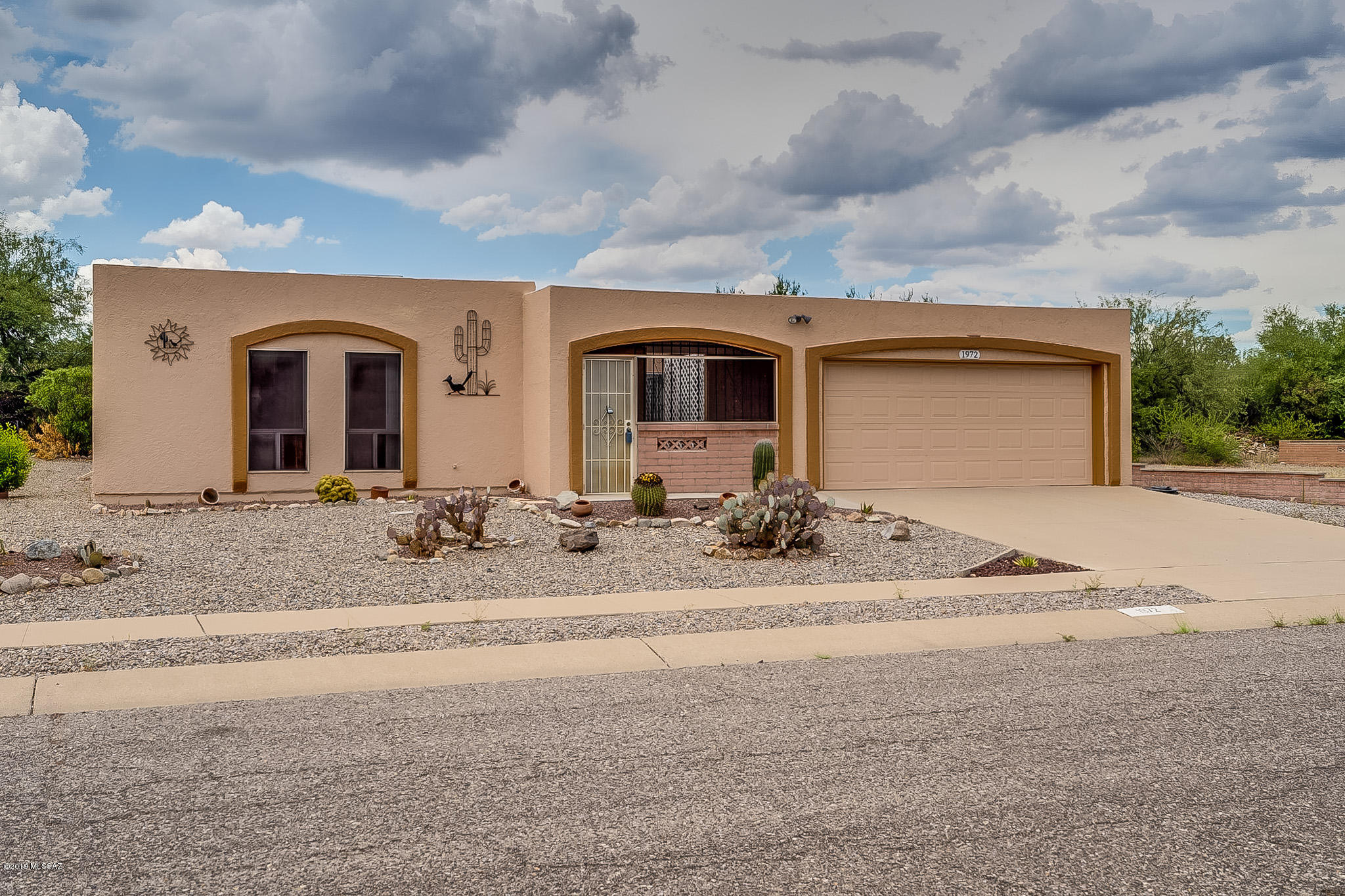 LOVELY TWO BEDROOM, TWO BATH HOME WITH A TWO CAR GARAGE IN DESIRABLE DESERT MEADOWS 3 NEIGHBORHOOD.  NEW WOOD GRAIN VINLY PLANK FLOORING IN LIVING ROOM, DINING AREA, AND BOTH BEDROOMS. TILE EVERY PLACE ELSE.  WALK IN CLOSET IN MASTER BEDROOM.  ROOF RECOATED IN 2019  EXTERIOR PAINTED IN  2019. TWO NEW TOILETS IN 2019..