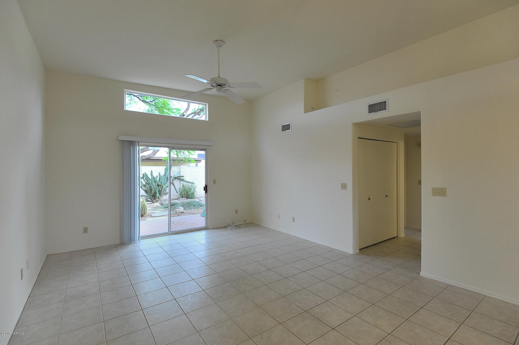 Charming home in tucked away Central location.  High ceilings, open great room floor plan, ceramic tile in living areas, carpeted bedrooms, skylights, washer and dryer.  Low care yard with covered patio to enjoy the mountain views.  Near bus line, Rillito River Walk, shopping, dining, and entertainment.  Minutes to TMC, U of A, and downtown.  Ask for #2197