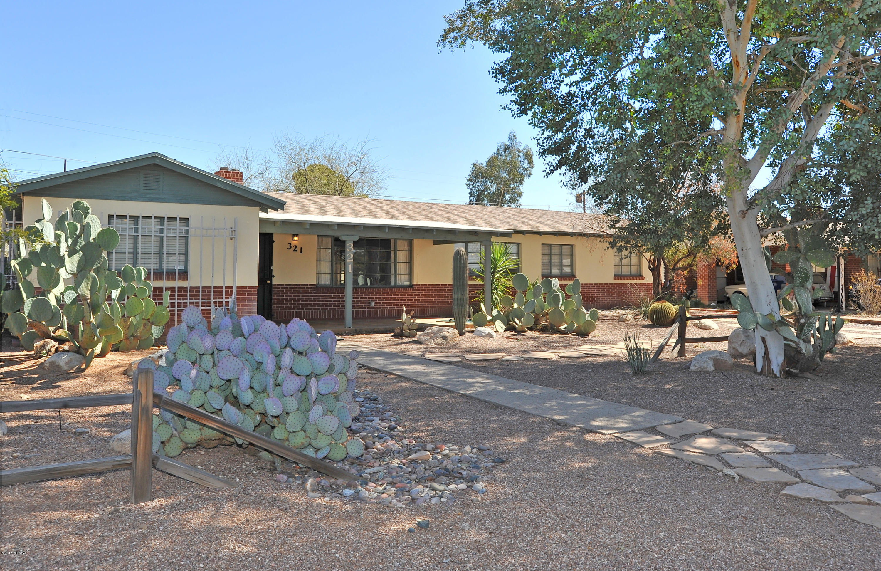 Sprawling ranch w/ attached guest unit on 1/4 acre in popular Broadmoor. 3 bed/2 bath main home + 1 bdrm/1 bath attached guest unit w/ full kitchen. Main home has colored concrete floors, fireplace + bonus room off kitchen that could be converted to 4th bedroom w/addition of cooling. Guest unit is perfect for elderly parent, home office or renter. Lg lot has room for a pool, gardens, kids area, chickens, RV. Lg workshop/garage accessible from rear alley. 10-15 mins to UA/Downtown & walking distance to Pizza, Bisbee Breakfast, Yoga & Sushi. A lovely walking path bisects this friendly neighborhood which is in process of applying for Historic Designation, which would mean lower taxes and higher values. This home needs some cosmetic updates to make it shine again, so bring your imagination.