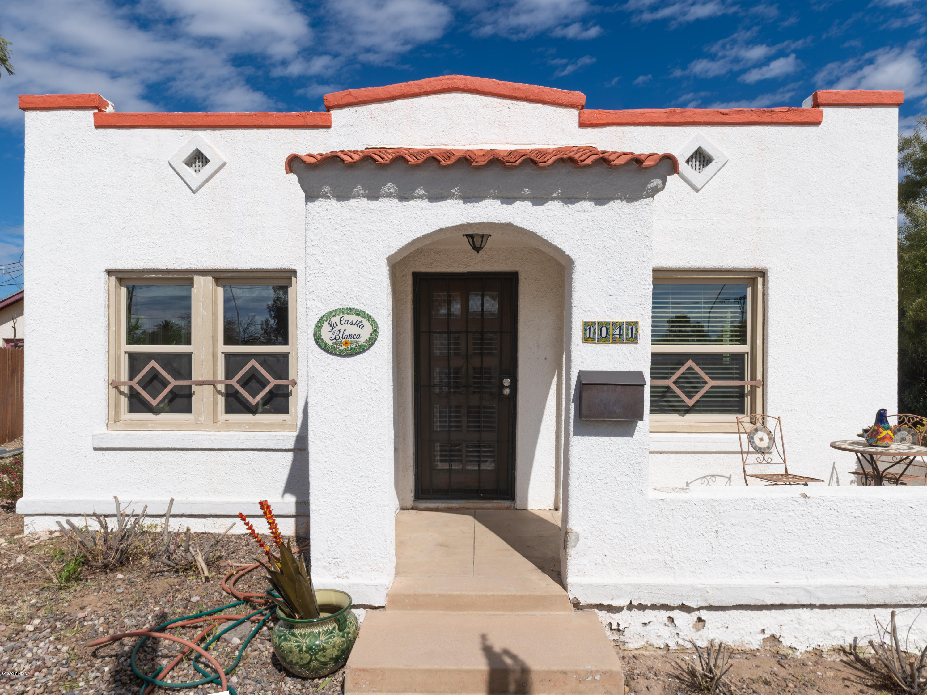 ADORABLE 1928 CRAFTSMAN BUNGALOW IN HISTORIC MONTEREY ADDITION JUST NORTH OF UA, BANNER MEDICAL & DOWNTOWN! THIS BEAUTIFULLY RESTORED MASONRY STUCCO CHARMER BOASTS  A LOVELY FRONT PATIO, ORIGINAL REFINISHED WD FLOORS & DOORS, DUAL PANE WINDOWS, COZY BRICK FIREPLACE, UPDATED ELECTRICAL &  HVAC, NEW ROOF 2019, ALARM SYSTEM, NEWER COUNTERS, CABINETS & DOUBLE SINK IN KITCH, UPDATED LIGHTING FIXTURES &  MANY OUTLETS, TANKLESS WATER HEATER, UPDATED PERIOD CORRECT HARDWARE PLUS HIGH END WINDOW COVERINGS. HM SITS ON A SPACIOUS R-1 LOT W/ SO MUCH PRIVACY. THERE IS PARKING IN FRONT PLUS ROOM FOR 5 CARS IN BACK. AFTER WIDENING GRANT ROAD, A BUFFER LANE WAS PUT IN AS WELL AS MASONRY WALL. DON'T LET THE ADDRESS CONCERN YOU. THIS IS A GEM OF A PROPERTY IN A GREAT LOCATION. A TRUE PIECE OF TUCSON HISTORY