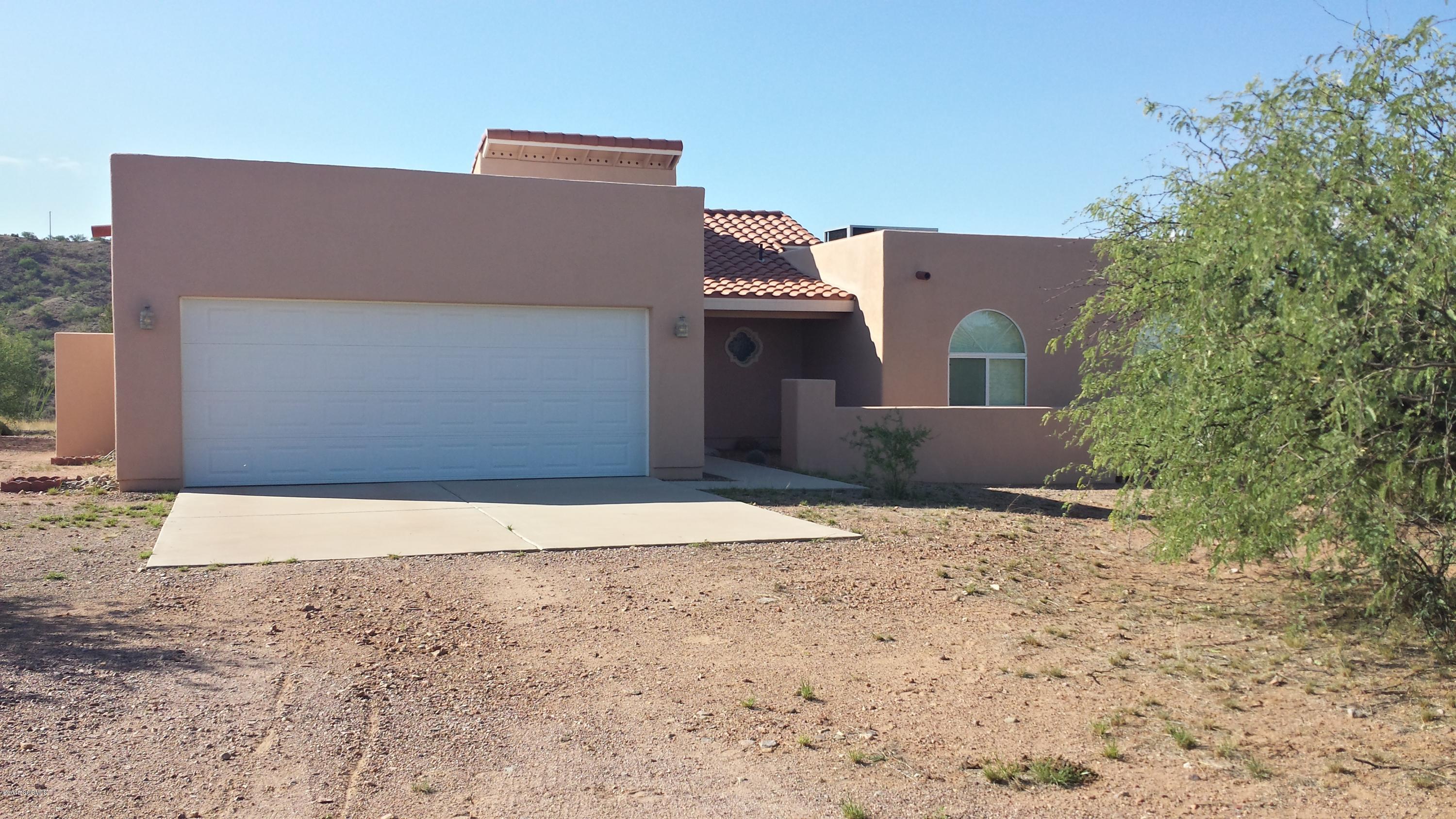 BEAUTIFUL and well kept custom home says, ''Bienvenido '' as you pass through the arched foyer. Living/Dining Room feature impressive 16' vaulted ceilings. Kitchen is open to a super Family Room area; in kitchen dining also! Warm maple cabinets, neutral ceramic tile compliment all rooms. The master retreat features a jetted tub, dual vanity/display niches. GORGEOUS 360 mountain views of the San Cayentanos, Atascosa Mountains/almost 40 acres of horse property.*BRING YOUR HORSES AND ATV'S*