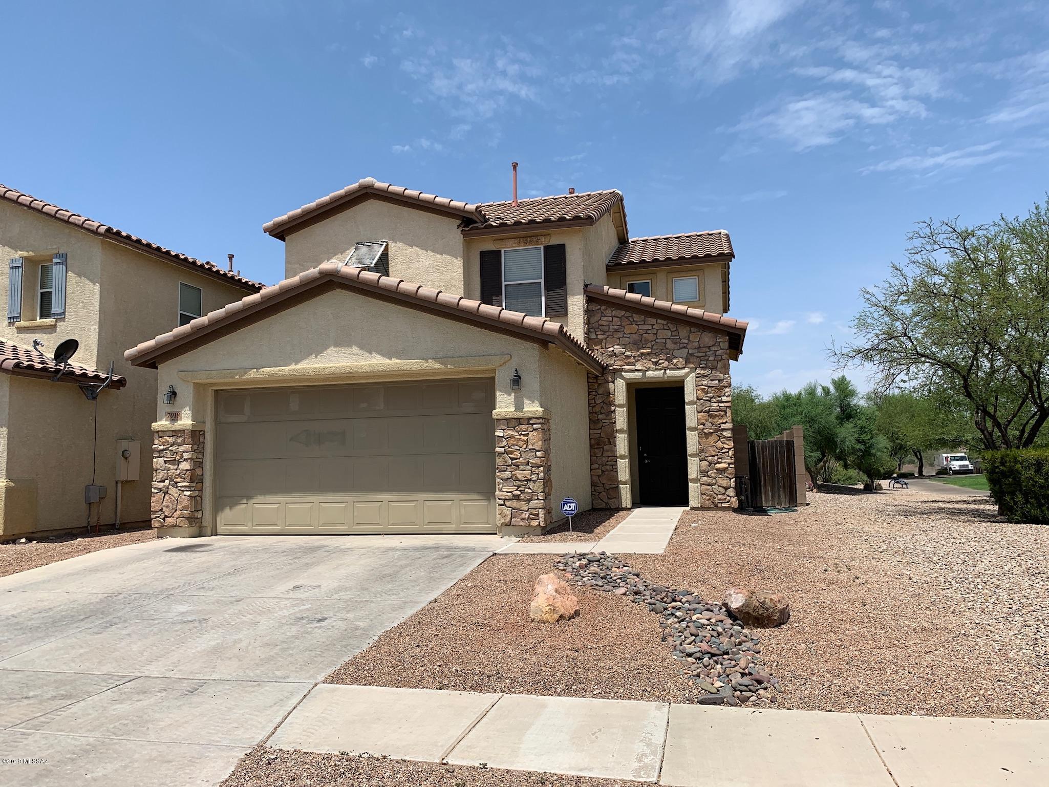 Great home with upgraded kitchen cabinets and Corian countertops, 3 bedrooms & 2.5 baths. Corner lot next to a neighborhood park & walking path. New tile on main floor, fresh paint, high ceilings and custom lighting. Stainless steele appliances in the kitchen, double sink and lots of counter space. Covered patio outside and views of the mountains.Laundry room is conveniently located upstairs next to the 3 bedrooms. Minutes away from Davis Monthan Air Force and easily accessible to I-10. Come visit this beautiful home. It won't last long!