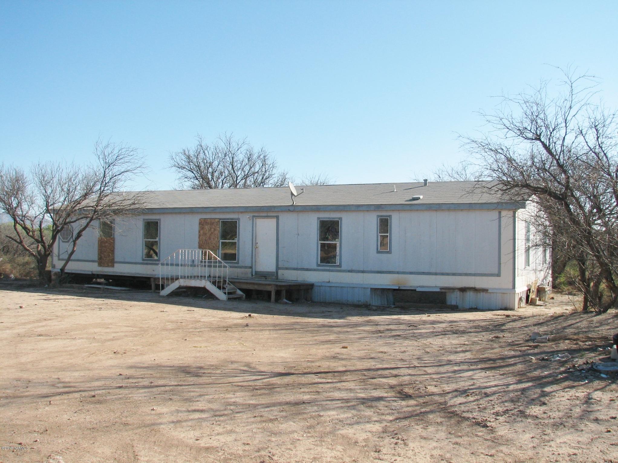 Lender Owned Foreclosure.  House needs major fix up.  2 Acres zoned heavy industrial just north of the San Pedro Golf Course. Taxes are for a larger parcel. Lender will not turn on utilities.  PROPERTY SOLD AS IS WITH NO WARRANTIES EXPRESSED OR IMPLIED.