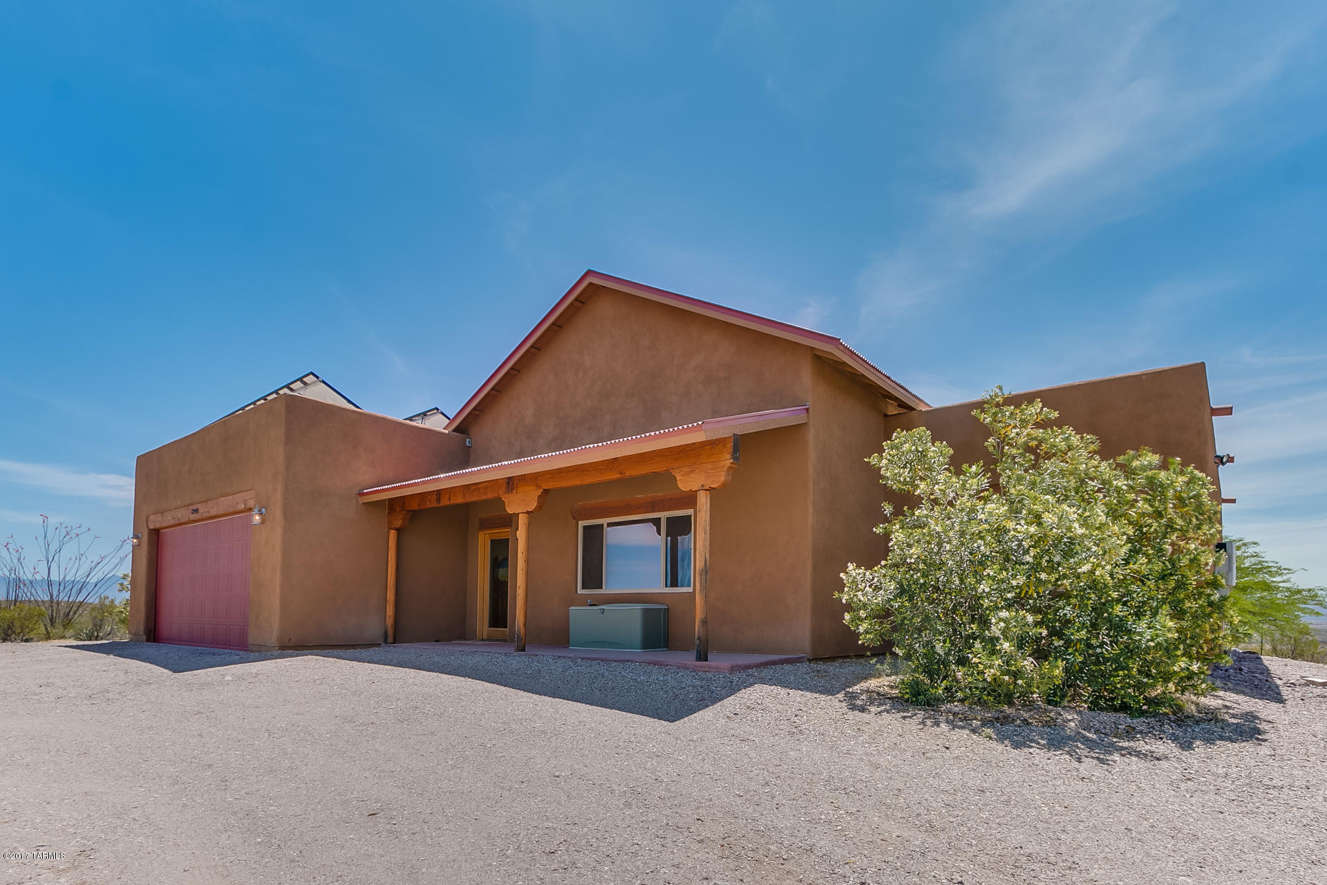 Stunning custom built home sitting on just over 4 acres. Relax on the back patio and enjoy the views
next to the fireplace or entertain in this open concept home featuring a great room with huge exposed wood beams, dining area with a fireplace,
alder kitchen cabinets with granite counters. Solid pine interior doors, concrete floors, solar upgrades that make your electric next to nothing. In the award-winning Vail School District. Come see this beauty! Easy access to freeway, approx. 30 min drive to downtown Tucson.