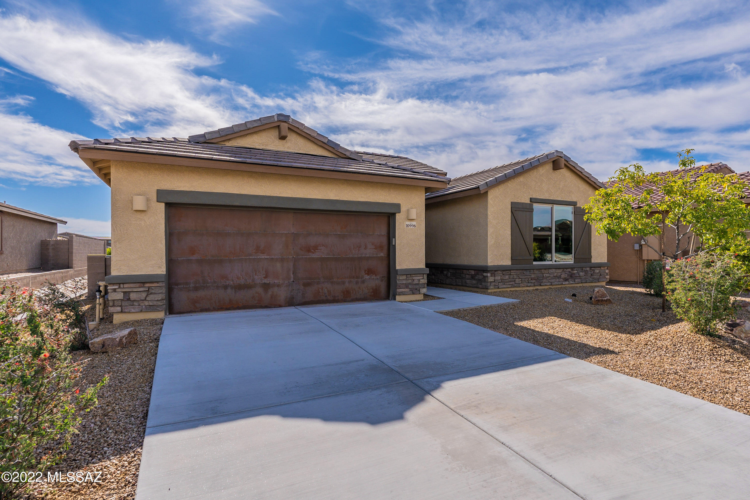 You'll find everything you need in this thoughtfully designed 4 bedroom, 3 bath home in THE ESTATES AT CAPELLA with mountain views from the back patio! The open great room flows effortlessly into the kitchen with a spacious dining area, and also has an office nook that creates a wonderfully flexible and social space. The master suite is tucked privately at the back of this split bedroom home. The large laundry room has a sink and lots of beautiful cabinetry. Within the gates enjoy the park, playground and walking trails. Close to all the local retail, restaurants, and golf with good proximity to I-10 too! One owner is currently licensed to sell real estate in the state of Arizona.