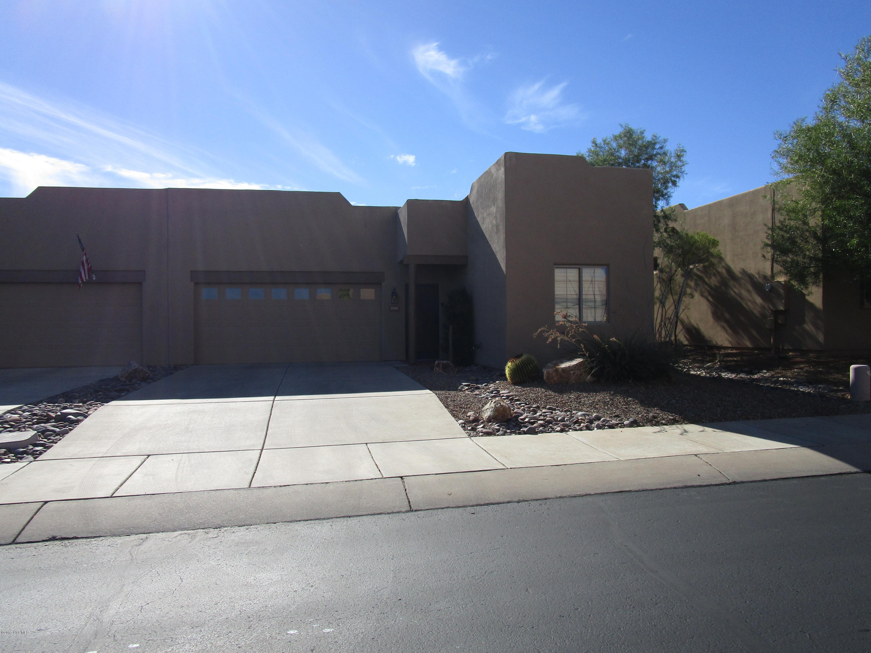 What a great find! The perfect winter getaway! Recently updated with fresh paint, automatic screen in the back, security screen door, comfort height toilets, and new PVC drip system piping. and fully furnished. Plenty of natural light, tiled living areas, corian like kitchen counter tops. The back yard faces common area and has built up privacy wall on either side; you will enjoy the cool evenings around the fire pit. The Santa Rita Mountains are at a right angle from either the front or back.