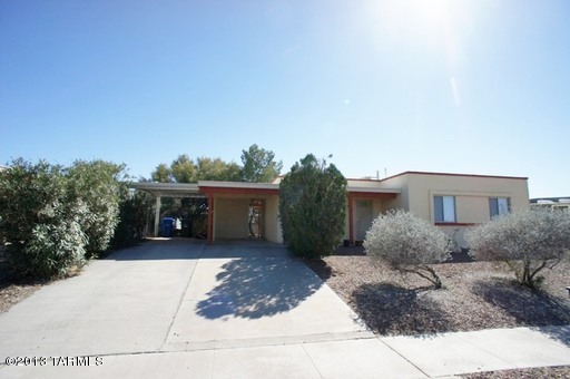 Beautiful Updated Masonry 3 Bdrm Ranch Style Home-Lots of Storage! A spacious Living room with nice flooring. Kitchen with Tile counters off Dining area. All Bedrooms with carpeting; Spacious Master with walk-in closet. A/C, Washer/Dryer in Laundry room with extra storage. Large Backyard has drive gate from alley, Covered Patio, Mature shade trees with low care landscaping, also storage metal shed. 2 Car Carport, TUSD Schools and Convenient Shopping. Clean and ready for move in! (Prudence/Stella)