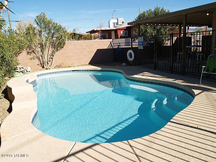 Leased through 7/28/2017. Large living areas and fabulous backyard with pool for this student rental house located less than one mile to UofA campus. Rented continuously since January 2010. Property has been well maintained with new AC unit in main house 2010 and new AC mini split in living room 2012. Roof was just recoated 8/2016. Tenants pay $1,500 a month rent and all utilities. Lease ends 7/28/2017.  Perfect for investor looking for cashflow or a parent looking for a house for student while attending UofA or Pima. Current management company can be retained to manage property. One of the owners is licensed to sell real estate in Arizona.