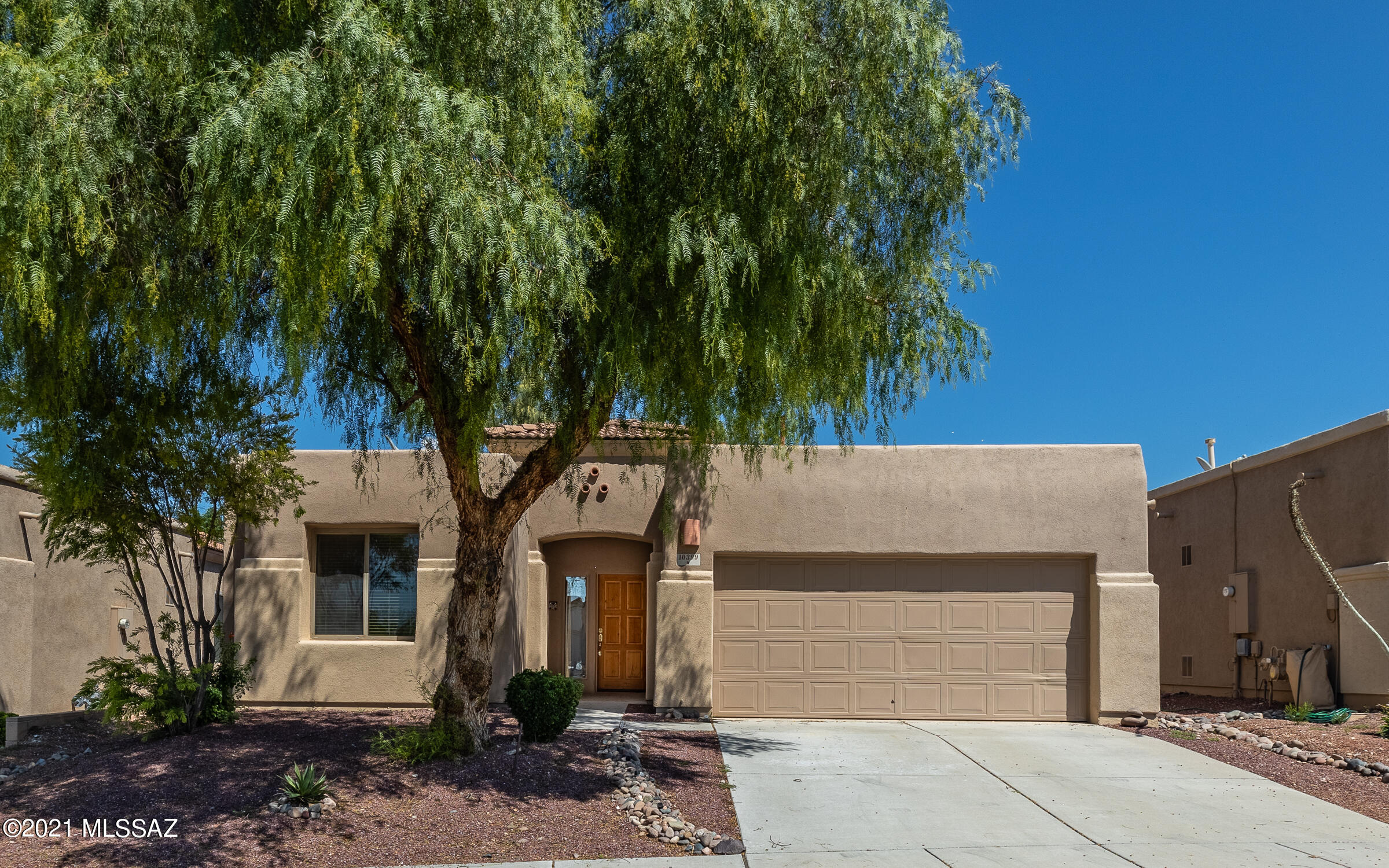 Hurry on over!  This 3 bed, 2 bath home, has a bonus room, 2 car garage, tile roof, & is in the Vail Dist! Front & back yards have mature vegetation & great sized covered patios!  You'll love the open floor plan & tall ceilings throughout.  The guest rooms are on one side of the home, while the bonus & owner's suite are on the other.  Tons of extras in this home from ceiling fans, tile everywhere except the bedrooms/bonus, window coverings, skylight, gas fireplace & a water softener.  Microwave is NEW!  There's NEW carpeting/padding, just installed.  ALL appliances convey, including washer, dryer, & fridge! ALL rooms are spacious, but the owner's suite is enormous w/a HUGE walk-in closet!  The owner's bath has been remodeled w/a stunning walk-in shower!  Back yard faces east!  Watch VIDEO!