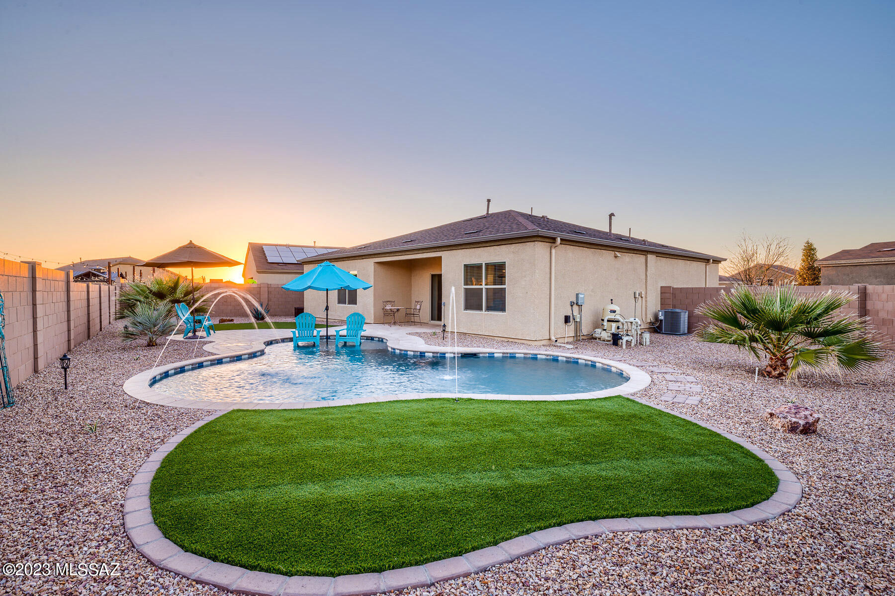 Bring your floaties! Welcome to your new piece of paradise. This gorgeous 2020-built D.R. Horton home exudes pride of ownership. 3-bedrooms and 2-bathrooms, meticulously maintained and ready for your family. The perfect oversized cul-de-sac lot with both sunrise and sunset views from the pool. The pool has a sit-in area for chairs and an umbrella for shade during the sunny summer afternoons. Upgrades include dual master closets, reverse osmosis, smart thermostat, smart panel, water softener, artificial turf, irrigation in front and back, gutters, epoxy flooring in the garage, fresh paint inside, and all appliances stay! Make this your home just in time for summer... And don't forget your sunscreen!