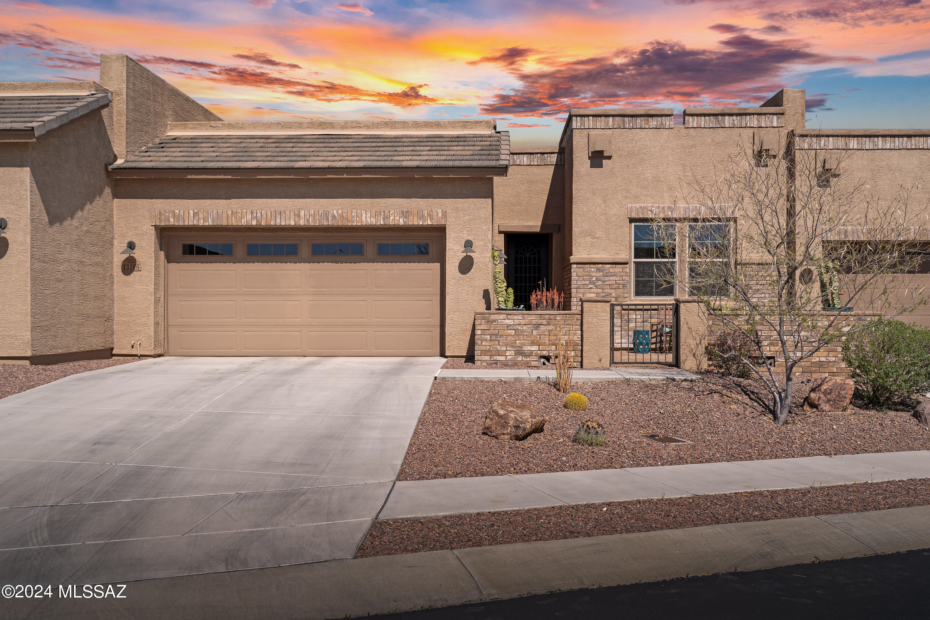 This exceptional TH boasts a plethora of contemporary upgrades & awe-inspiring mountain views, creating the perfect blend of style & serenity. Sleek & sophisticated design w/open-concept living area w/expansive windows framing panoramic vistas of the Catalina mountains. Gourmet kitchen hosts staggered cabinetry, gorgeous granite, gas cooktop & huge island w/breakfast bar-perfect for entertaining! Master retreat hosts mtn views, oversized walk-in closet, dual sinks & custom walk-in shower. Good-sized guest room w/large custom walk-in closet & extra den/office area w/add'l storage. Perfect patio living- enjoy sunrises & cool afternoons from private back brick paver patio or watch the sun set from front courtyard patio. Epoxy coated garage w/extra shelving & wkbench, water softner & more!