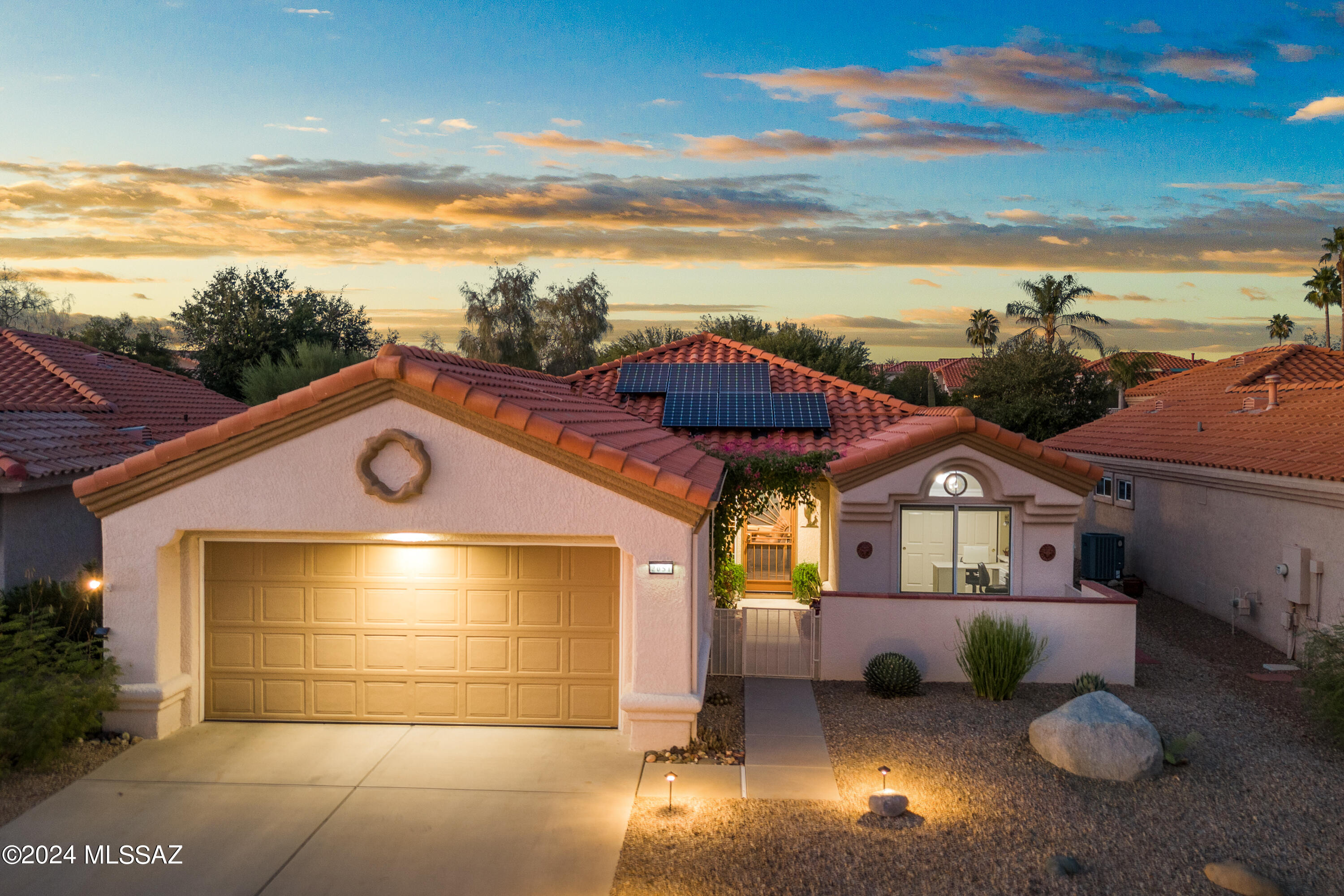 Your retreat in Sun City Oro Valley Active Adult Community awaits! This beautifully updated Mariposa Model home offers 1,190 sq. ft. of comfortable living space w/ 2 bedrooms & 2 full baths. The open floor plan is perfect for relaxed living, while the owned solar system ensures energy efficiency year-round. Step outside and enjoy a park like back yard, a tranquil setting for morning coffee or evening relaxation. The front patio boasts stunning views of the Catalina Mountains creating peaceful desert ambiance. Included with the home is the golf cart adding extra convenience for exploring the communitie's exceptional amenities including an 18 hole golf course, fitness ctr, pools & clubs. This home is move-in ready and offers an ideal combination of modern upgrades and serene outdoor space.