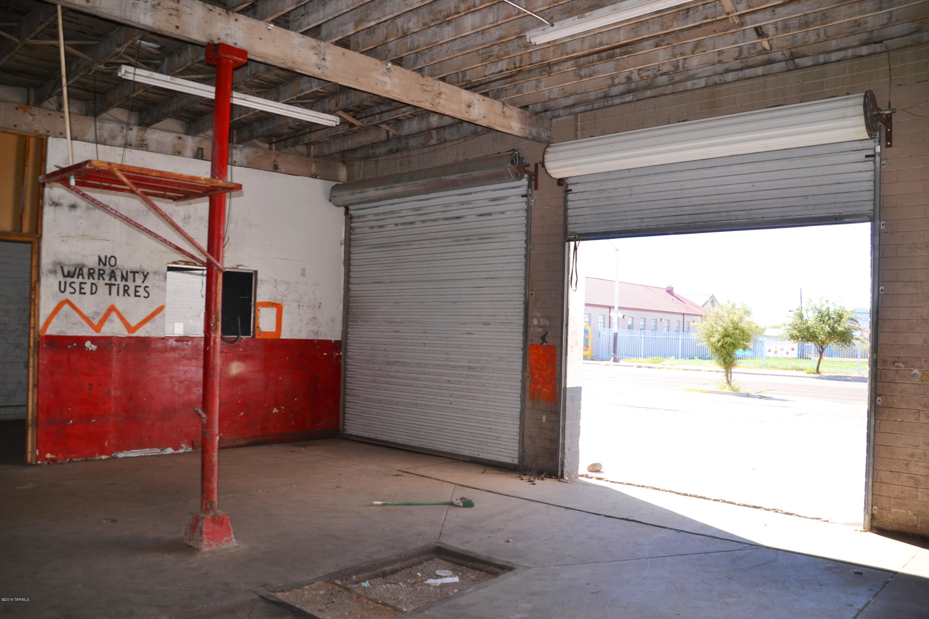 C-3 zoned 1210sqft building with 2 bay garages perfect for tire shop, auto repair, paint and body shop, upholstery shop etc.. Approx 1000sqft storage building behind main building can be used for storage but is in need of roof repairs. High traffic area and close to freeway. Sold as is conditions. Motivated seller!! There is a common wall that is shared with the building to the north, this listing/building is ONLY the building to the south. See last photo to show the apporximate property line.
