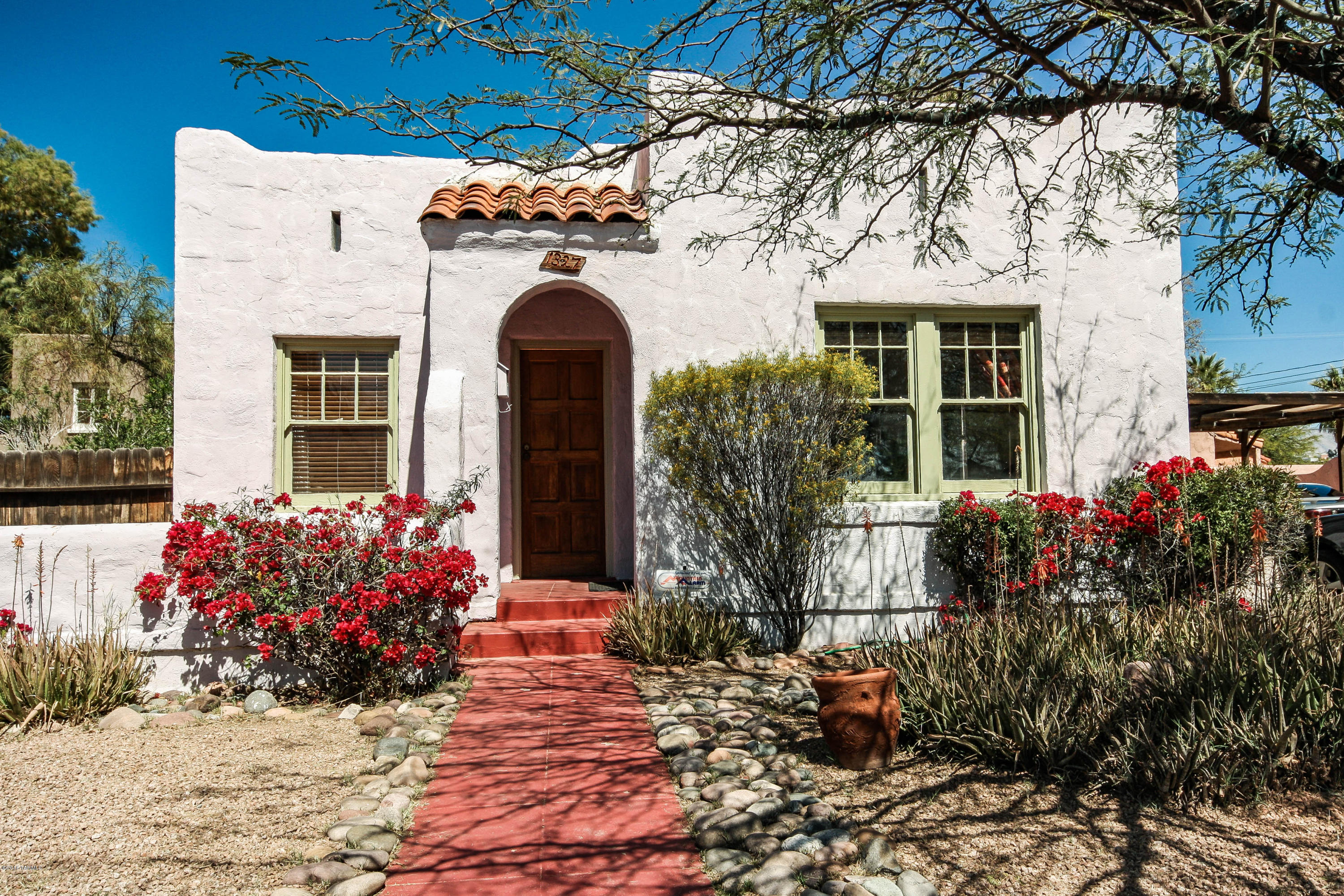 LOCATION, LOCATION,LOCATION!!! Charming Historic 1920's bungalo located a block from UA campus right off Mountain. 2 bedrm plus gst qrtrs. Wood floors, fireplace and cozy back yard.House is 961 sq ft and gst qtrs is 292 sq ft.