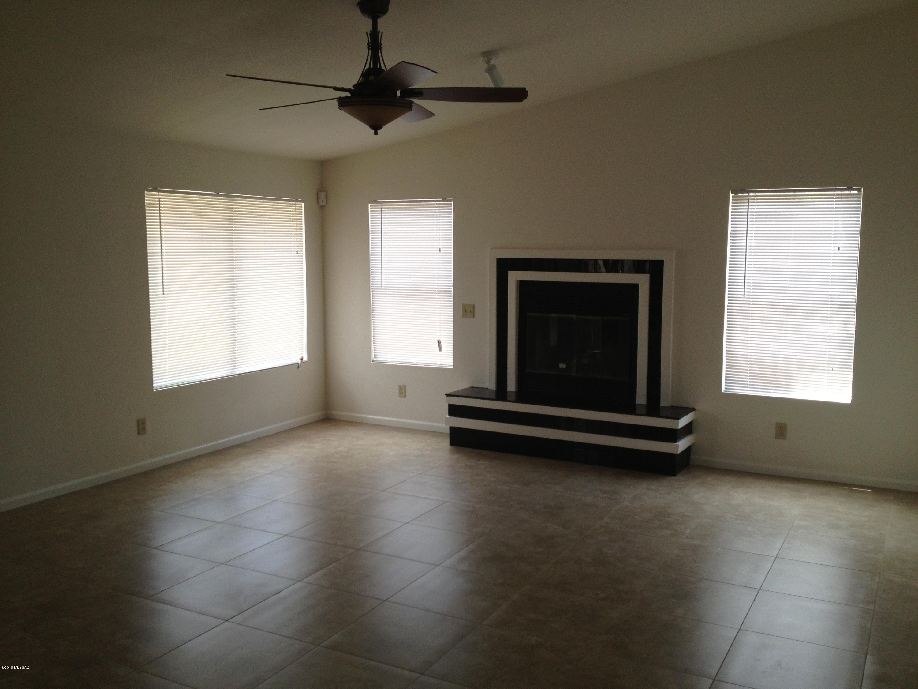 Beautiful updated home in Laurel Heights! Tile flooring throughout. Spacious family room with vaulted ceiling and fireplace. Lovely wood cabinetry, breakfast bar, and butler's pantry in kitchen. Sunny breakfast area. Master bedroom has en suite bath with double vanity and walk-in closet. Arizona room. Split floor plan. No poly pipes!