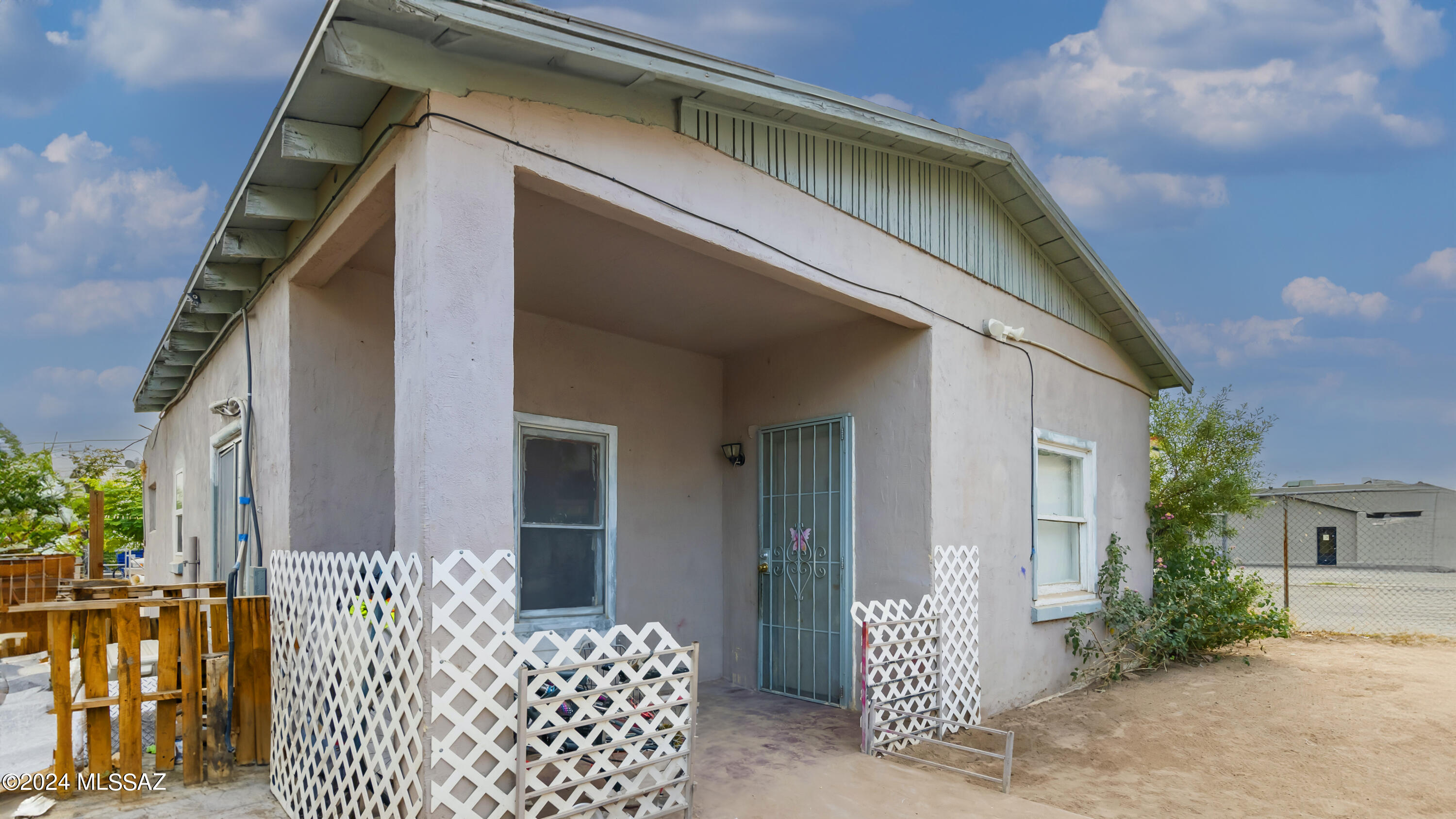 Charming South Tucson home featuring a detached studio apartment! This cozy home boasts ample patio space perfect for entertaining under the Arizona sun. Enjoy the versatility of a separate studio for guests or rental income. Don't miss out on this unique opportunity to own your slice of desert paradise! This inviting home is perfectly located near shops, U of A and only 6 minutes from downtown! Main house is now vacant. Each dwelling is separately metered for electricity, gas and water. New mini splits were installed in July 2023. Studio apartment has a brand new water heater.