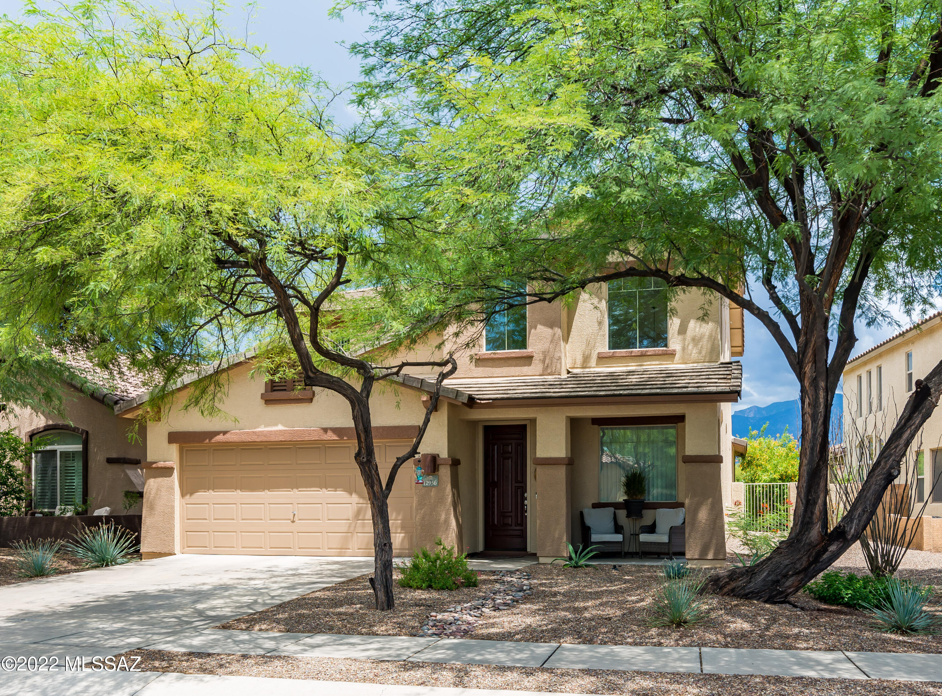Take in the Catalina Mountain views from the backyard of your new Oro Valley home.
This meticulously maintained two story home has been updated with new kitchen cabinets and backsplash, 
updated appliances, ceiling fans, light fixtures, window treatments, satin nickel door hardware and fresh paint inside and out.  
Move in condition!  Vaulted ceilings in the formal dining/living room provide a bright flowing entrance to the large kitchen and family room with a gas fireplace.
The primary bedroom on the first floor offers flexibility for many lifestyles as does the second bedroom and 3/4 bath on the first level. The three ample bedrooms upstairs offer a variety of options for either children, visitors, fitness, crafts or a home office.  
Just minutes from Innovation Academy.