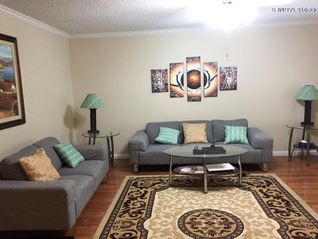 GREAT COMPLETELY RENOVATED TOWNHOUSE. New A/C unit, Brand new Water Heater,New flooring (NO CARPET),Fresh paint and much more. All APPLIANCES REMAIN INCLUDING FRONT LOAD WASHER AND DRYER,STAINLESS STEEL STOVE,MICROWAVE,DISHWASHER AND FRENCH DOOR STAINLESS STEEL FRIDGE. NEWER DUAL PANE WINDOWS, WOOD SHUTTERS..UPDATED BATHROOMS WITH NEW VANITIES, FAUCETS,TOILETS AND TILE TUB AND SHOWER SURROUNDS. NEW LIGHT FIXTURES AND WROUGHT IRON SECURITY BARS!!GREAT HOME!!!COME AND SEE!!!
