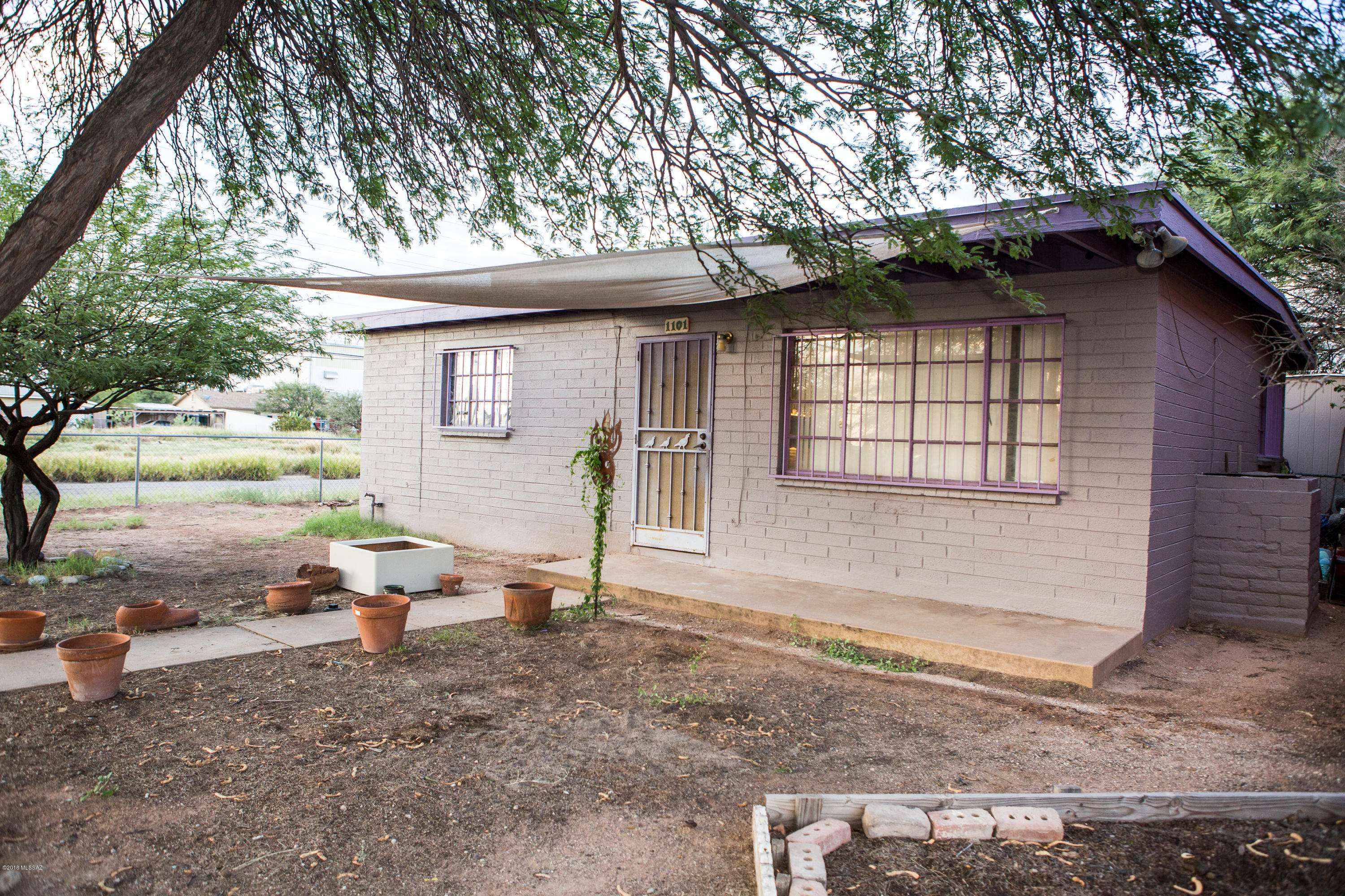 Great Bungalow on Corner Lot with HUGE yard, Ultra Convenient CENTRAL Location,  AND with privacy!  R-2 Zoned, Off Street Parking, and again a HUGE yard!  Large Storage Building included!   1.5 miles to Downtown, Historic 4th Ave, and I-10; 2 miles to UofA; Half a mile from the Aviation Bike Path. 15 minutes to the Tucson Airport.  Additional information included in MLS below regarding the potential for the Millville 
 neighborhood where this property is located.  Come check this one out quickly! Millville Neighborhood

This neighborhood is truly diverse; a very eclectic neighborhood with a good mix of residential and mom-and-pop stores creating that mixed-living culture that is very attractive. The railroad cuts right through this neighborhood, but adds to the rich and diverse character present. Barrio Metalico and Ice House Lofts, both residential developments, were completed in late 2004 and spring 2005 respectively. The market and brewery are the central hubs for Tucsonans and residents. Residents and merchants alike believe this is a neighborhood with the greatest potential for infill and growth.