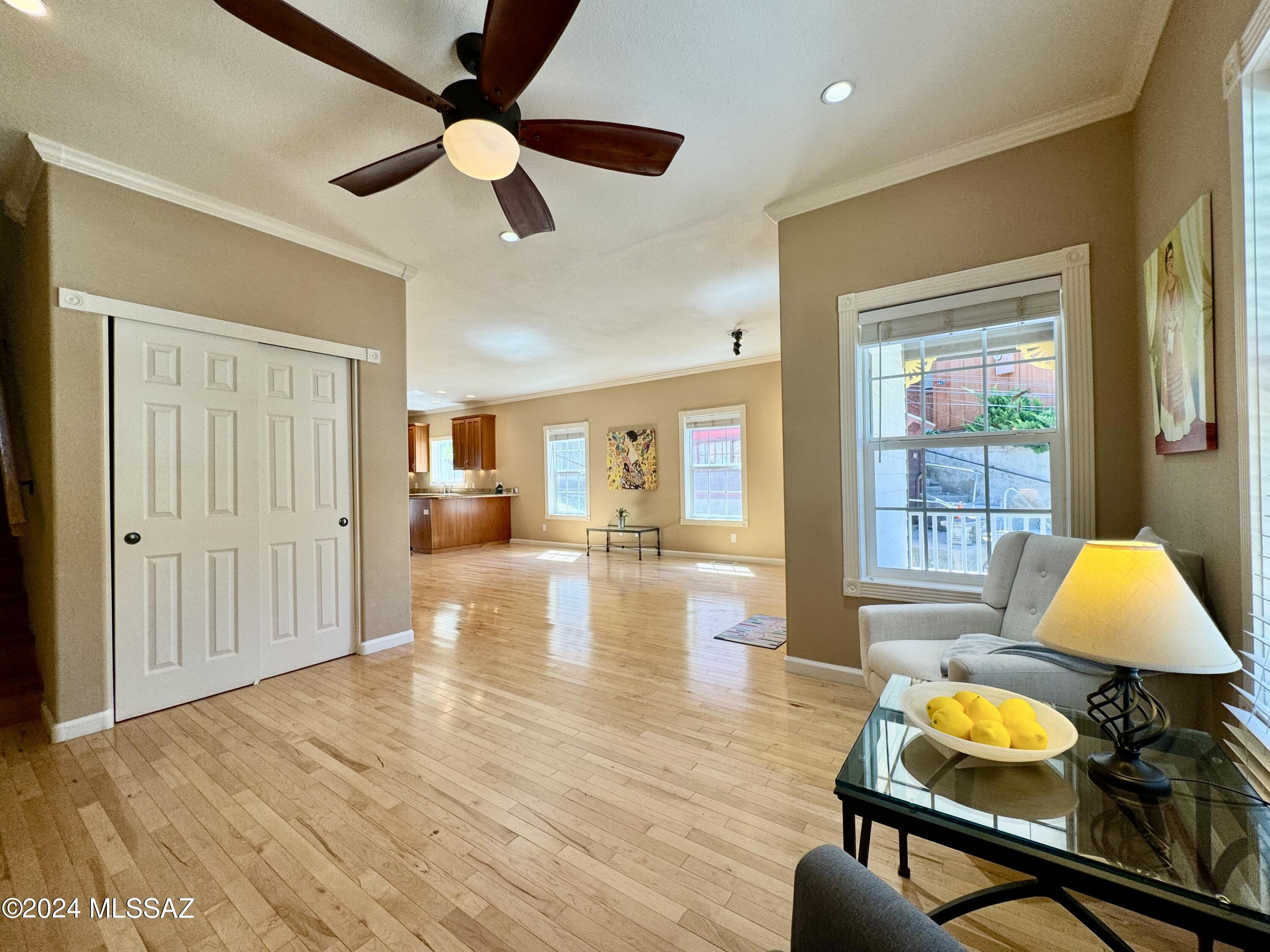 Gorgeous Old Bisbee home built in 2008 w/ Deeded Parking! 2 bedroom 2 bath w/ stunning features. You'll love this home!  Hardwood floors, crown moulding, abundant windows throughout. Stainless Steel appliances, Granite Counters & wonderful private back patio off the kitchen. Split floorplan w/ Guest Bedroom & Bathroom downstairs & Primary Ensuite upstairs spanning almost the entirety of the 2nd floor!  Sit on the front porch sipping your morning coffee & take in the mountain views or cheer on participants in the Annual Bisbee 1000 Stairclimb. Centrally located in the Historic District, close enough to take advantage of the Entertainment District's bars & restaurants, but just far enough away to enjoy the calm mountain vibe. Seller providing Buyer a Home Warranty Policy too! Welcome Home!