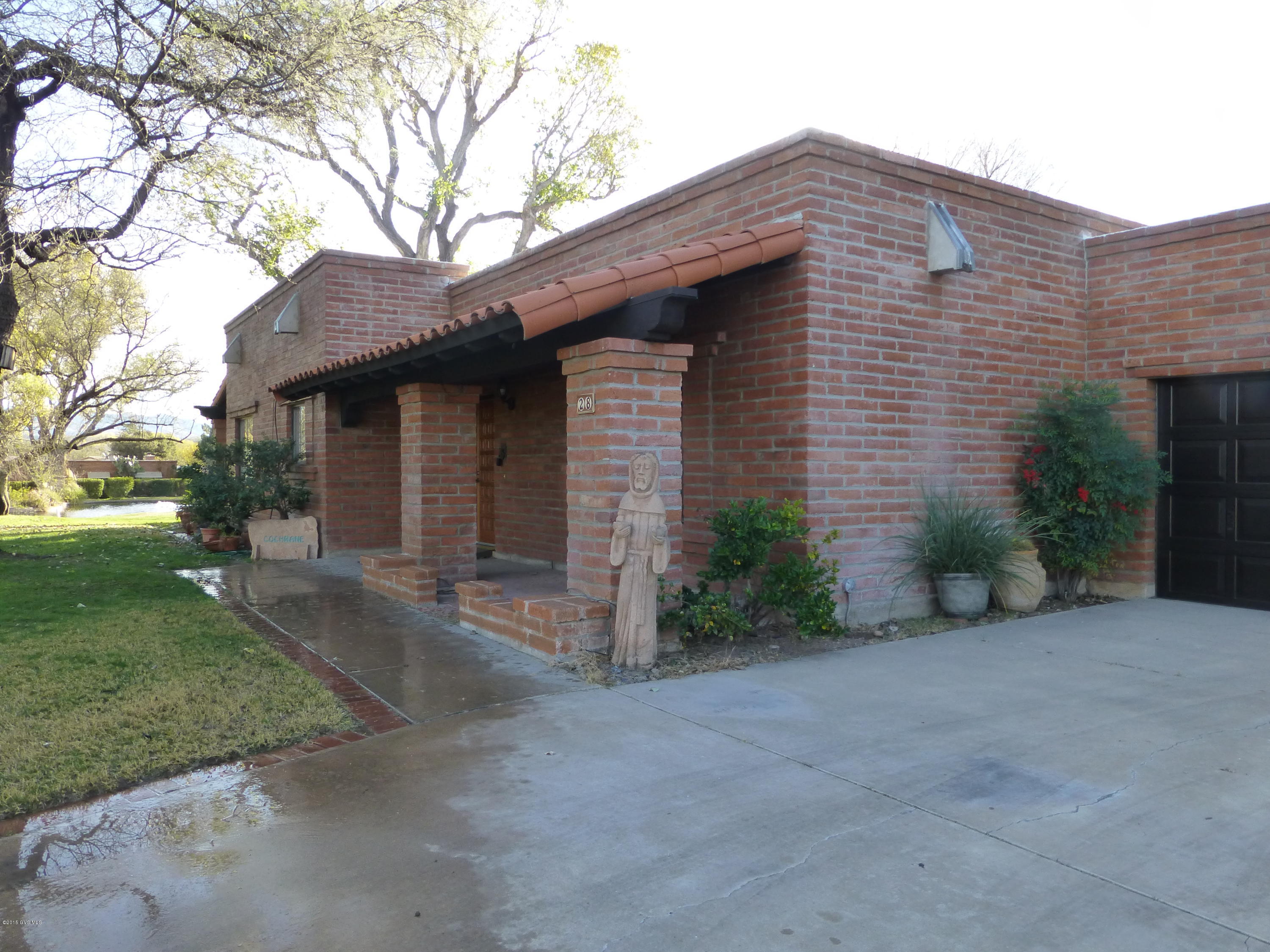 Perfect Location and great street appeal. On the golf course-with a super view of the golf course and lake. Stunning great room with wood burning corner fireplace open with high ceilings, 2 bedrm, 2.5 baths, loads of storage and TILE floors through out, 2 covered patios and 2 car garage