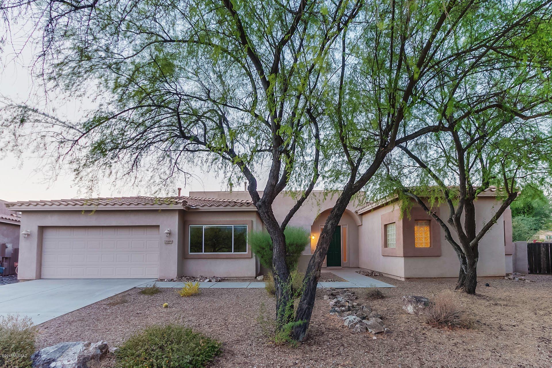 Ranged Priced-Seller will accept or counter offers between $350,000-$390,000.APPROVED SHORT SALE-at $390,000. Gorgeous single level Home on 16th hole of Rancho Vistoso Golf Course! Pride of Ownership inside and out! Warm & welcoming palette, tile floor, soaring ceilings, French doors to patio, ceiling fans & plush carpet. Formal dining area with coffered ceiling. Fantastic chefs kitchen features center island, corian counters, breakfast bar, SS appliances & wood cabinetry. Perfect Home for entertaining. Cozy family room fireplace, built-in shelves, and patio access. Large windows allowing for lots of natural light throughout. Grand master retreat boasts private en suite and walk-in closet. Generous size bedrooms, ample closets, and 3 baths.