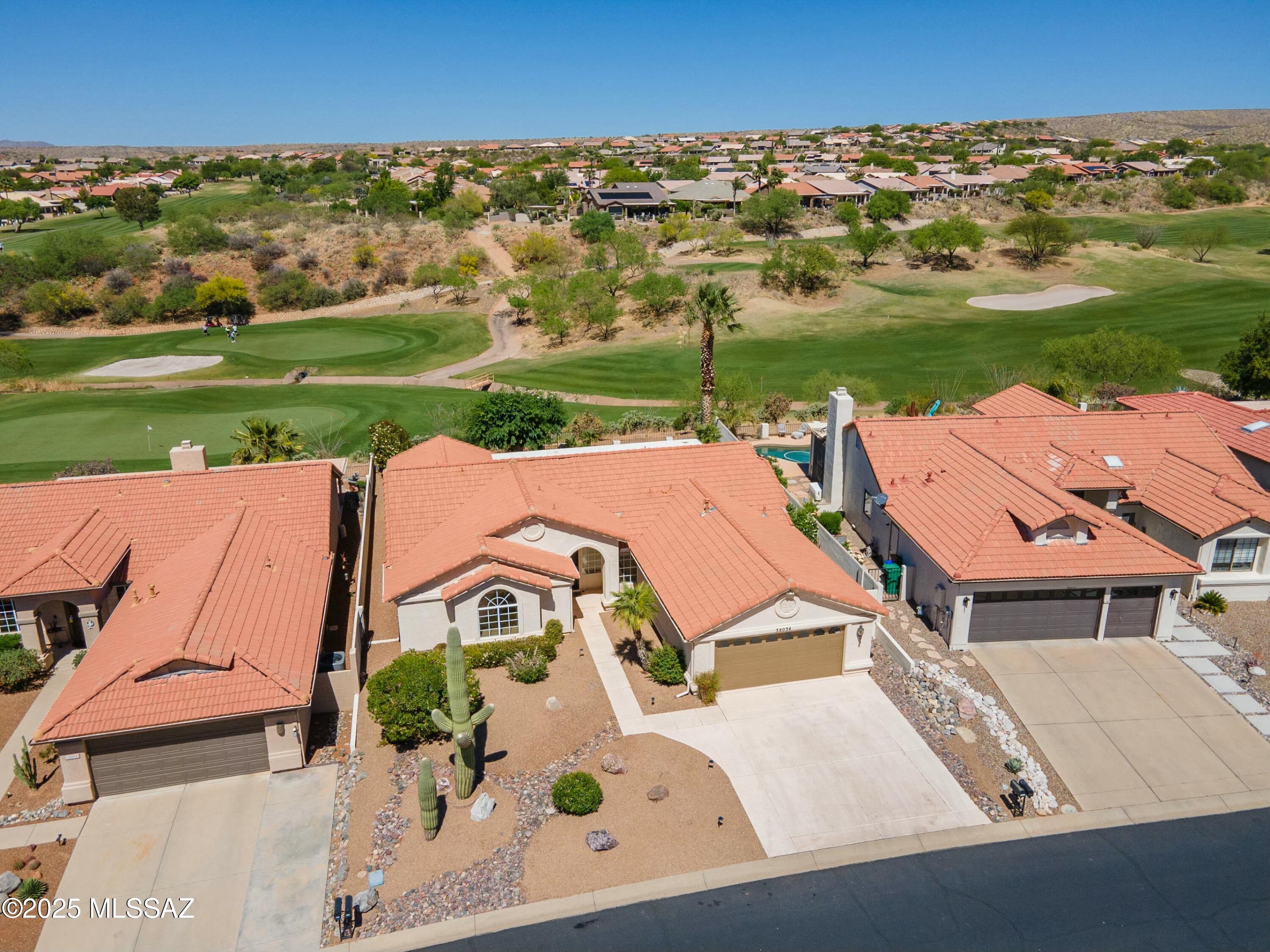 Inviting you to enjoy golf-inspired living at its finest. Step into this lovely 2BR 2 1/2 Ba Topaz in the highly sought after HOA 1 neighborhood and Unit 9. You will enjoy unobstructed panoramic sweeping golf course views with this lovely home perched high on an elevated lot above 5th fairway of the Catalina golf course. As you step through the sliding doors leading onto the spacious shaded patio, you will be in awe with the courses lush green carpeting on pristine greens.  This property and backyard oasis features mature vegetation including saguaros, a massive palm tree, and picturesque desert landscape with ample room to add a pool/hot tub. Use your creativity in remodeling this lovely home to your desire.