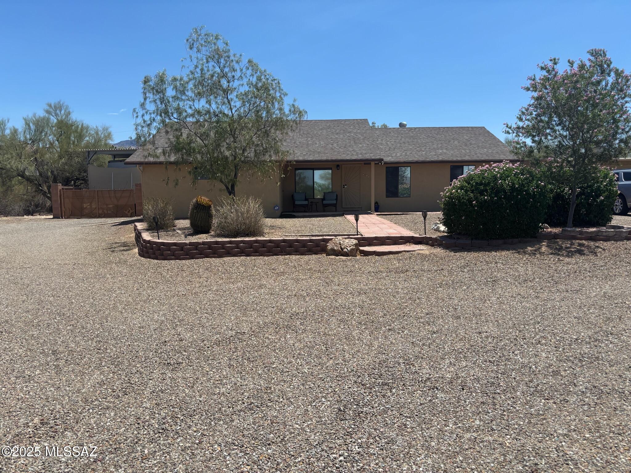 This stunning property offers a rare combination of spacious living, privacy, and no HOA restrictions. Don't let the address intimidate you; this home is set way back off of La Canada providing peaceful living with the advantage of nearby conveniences.
Enjoy the benefits of an attached 2-car garage and a detached 2-car garage, ensuring plenty of room for vehicles and storage. The property also sits on nearly 1 acre with covered RV parking and is perfect for those who love to explore and need space for their recreational vehicles. Enhance your outdoor cooking experience with the convenient built-in barbeque, ideal for grilling and entertaining family and friends.