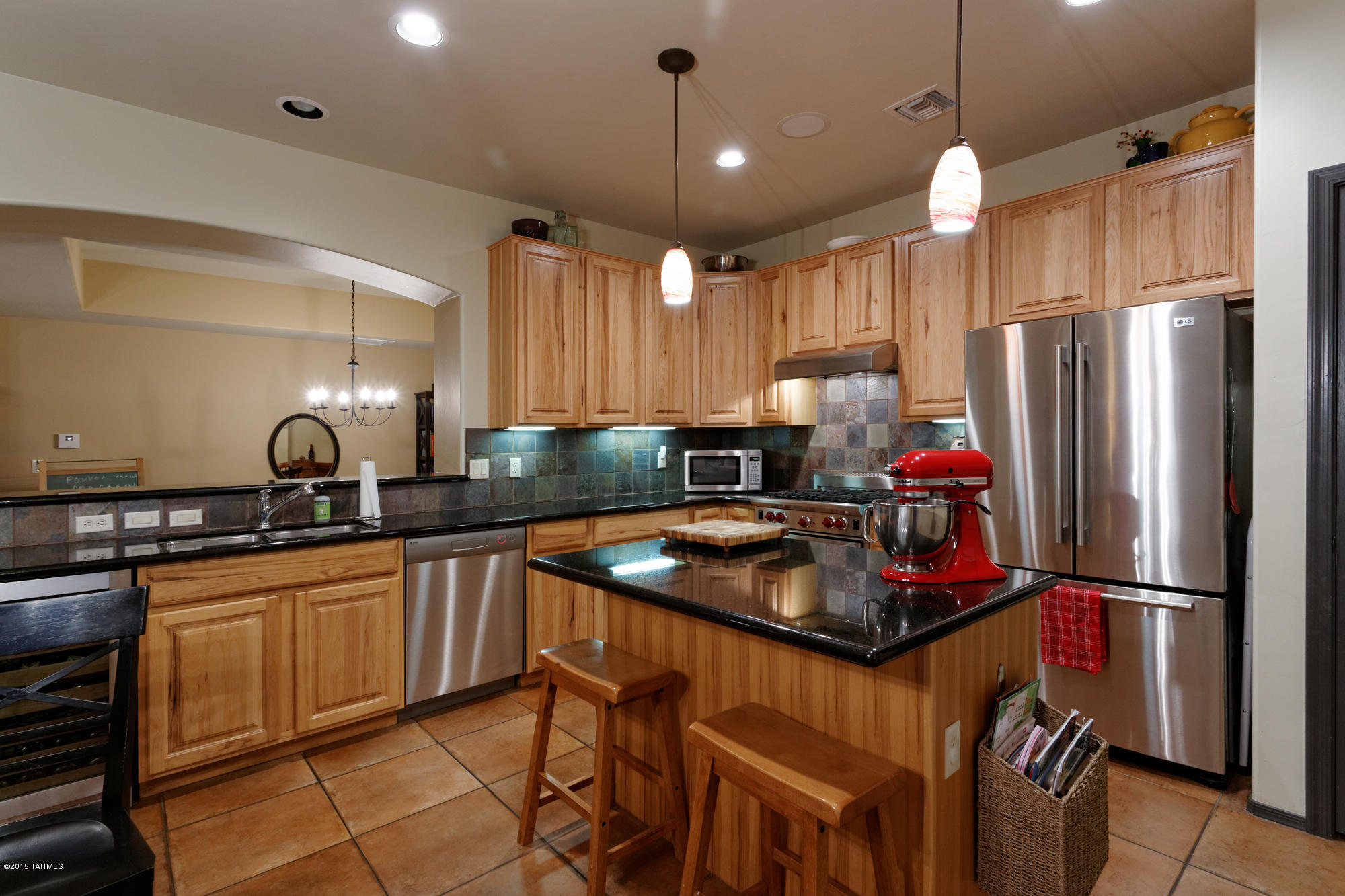 Looking for WOW in Civano? Come check this out. Gorgeous, highly-upgraded 5BR/3BA+Loft near the pool and ball field in the one-and-only Civano. The only thing left to do is move in and enjoy! Wolf range, Asko dishwasher, LG fridge & GE Monogram beverage fridge and hood make cooking and clean-up a pleasure. Feel spoiled with the perfect 18” floor tile thru-out the first floor and the upstairs bath, slab granite counters with custom tile backsplashes in the Kitchen and all bathrooms, custom tile shower/tub surrounds & Kohler bath fixtures. Even the ceiling fans and window coverings are upgraded. Greet guests in your entry courtyard with flagstone patios front and back leading to custom security screen doors and rear screened-in porch. The kids have their own space upstairs and the lovely.. Master is on the main floor close to everything else. The two downstairs spare bedrooms are great for little ones, hobby rooms, or guests. The home is energy-efficient, too, with solar tube lighting and a solar hot water system. Sellers have used only low/no-VOC paints on the interior. Exterior has been repainted. Extra storage has been installed in the Loft and in the garage. It's ready for you!