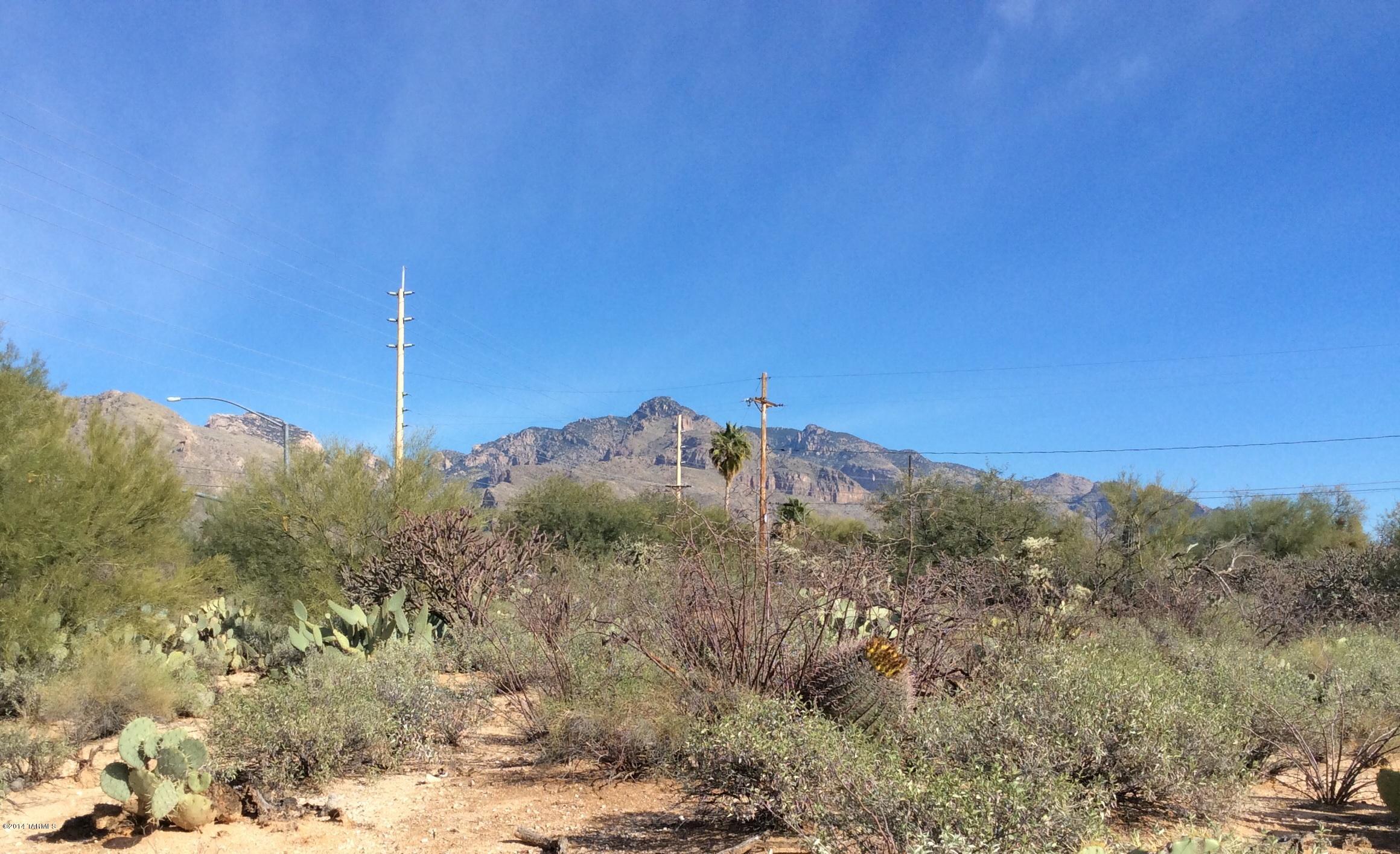 One of the most affordable, easy build, foothills lots you'll find. With BIG MOUNTAIN VIEWS, all utilities included sewer, No HOA or CC&R's, this is a MUST SEE. Sought after Casas Adobes area by Westward Look and a short drive to Oracle Rd and Campbell Ave shopping and amenities. Natural vegetation remains on this end of cul-de-sac site.