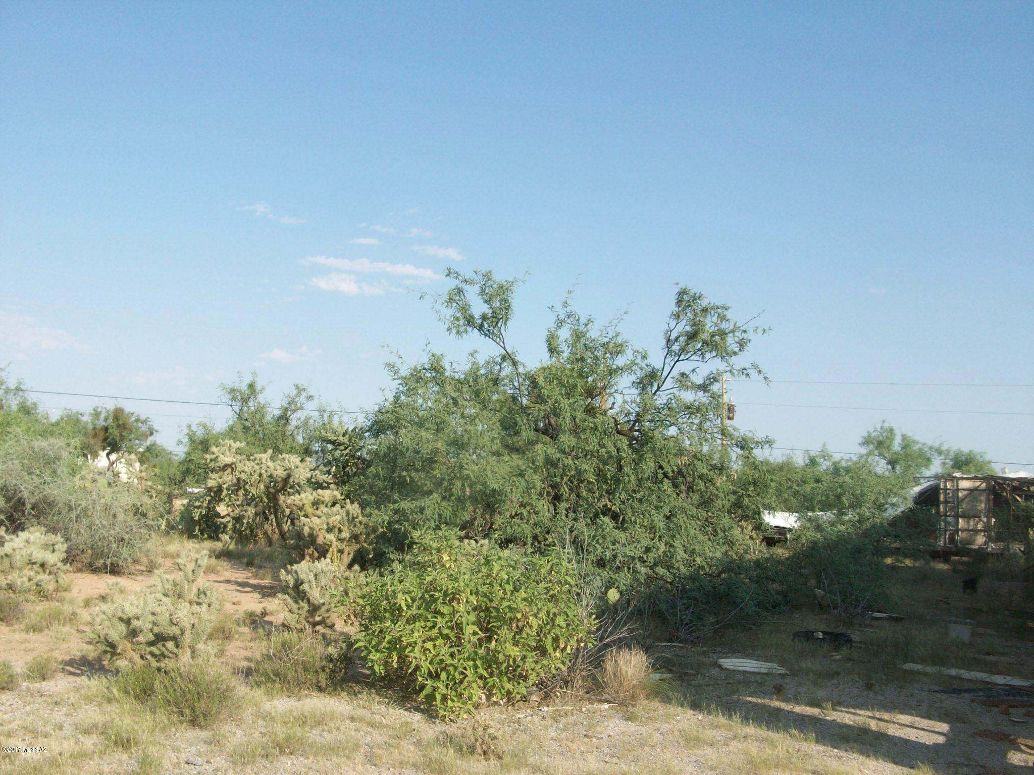 Virtually one acre in area of similar - Electric stand, septic on property - tax shows affixed manufactured home - that is ready for tear down - bring your own into this lot.  Secluded area.