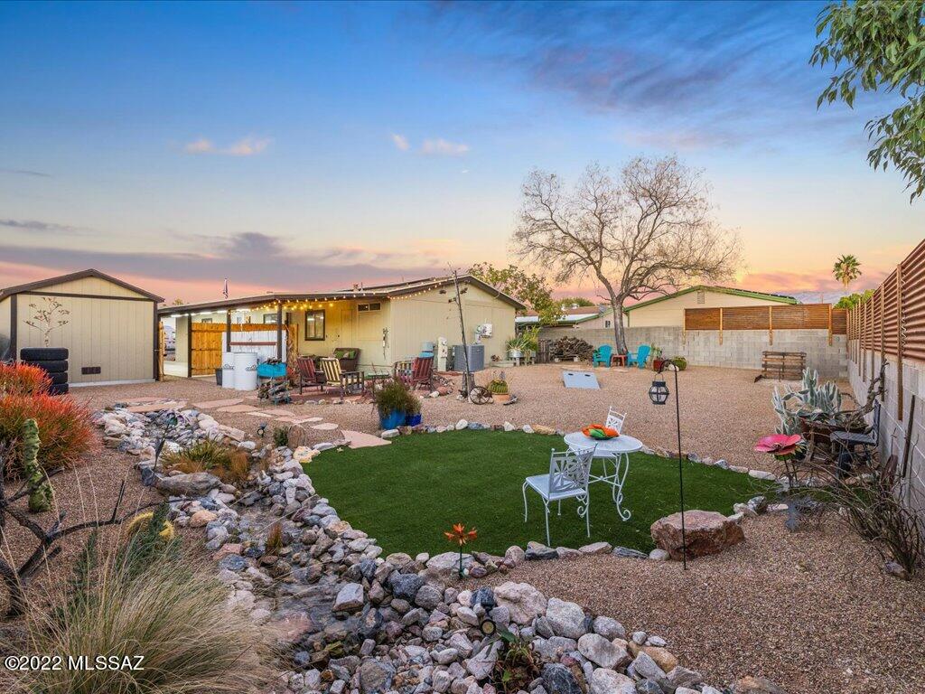 Amazing opportunity to own a charming 3BD/2BA, 1,536 SqFt home, with many recent upgrades and incredible outdoor spaces.  Wonderful landscaping surrounds the entire home, creating your own backyard paradise in the desert.  Low maintenance plantings, fire pit and outdoor waterfall make this outdoor space, a can't miss.  Recent upgrades include fully remodeled owner's bath, tasteful kitchen modifications, HVAC, Solar PV System and large Tough Shed with electricity; as well as a completely remastered backyard. Conveniently located near shops, dining and schools with NO HOA.  Come checkout this beautiful property today!