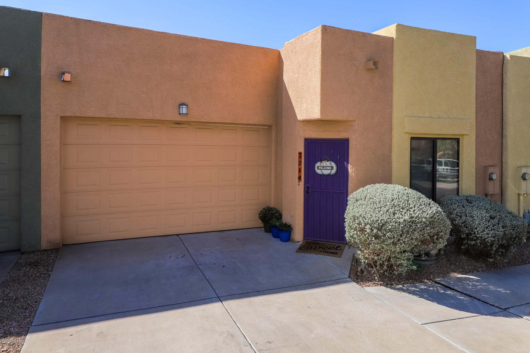 Gorgeous 3bed/2bath townhome with a 2 car garage! This place has been well taken care of, tile added to the high traffic areas. This great layout is open in the living space and puts the rooms at the back to create privacy. Small yard for low maintenance and yet still enough space to hangout and for the pets. Good size laundry room can fit full size units and storage space! New Water heater. Come check this one out today!